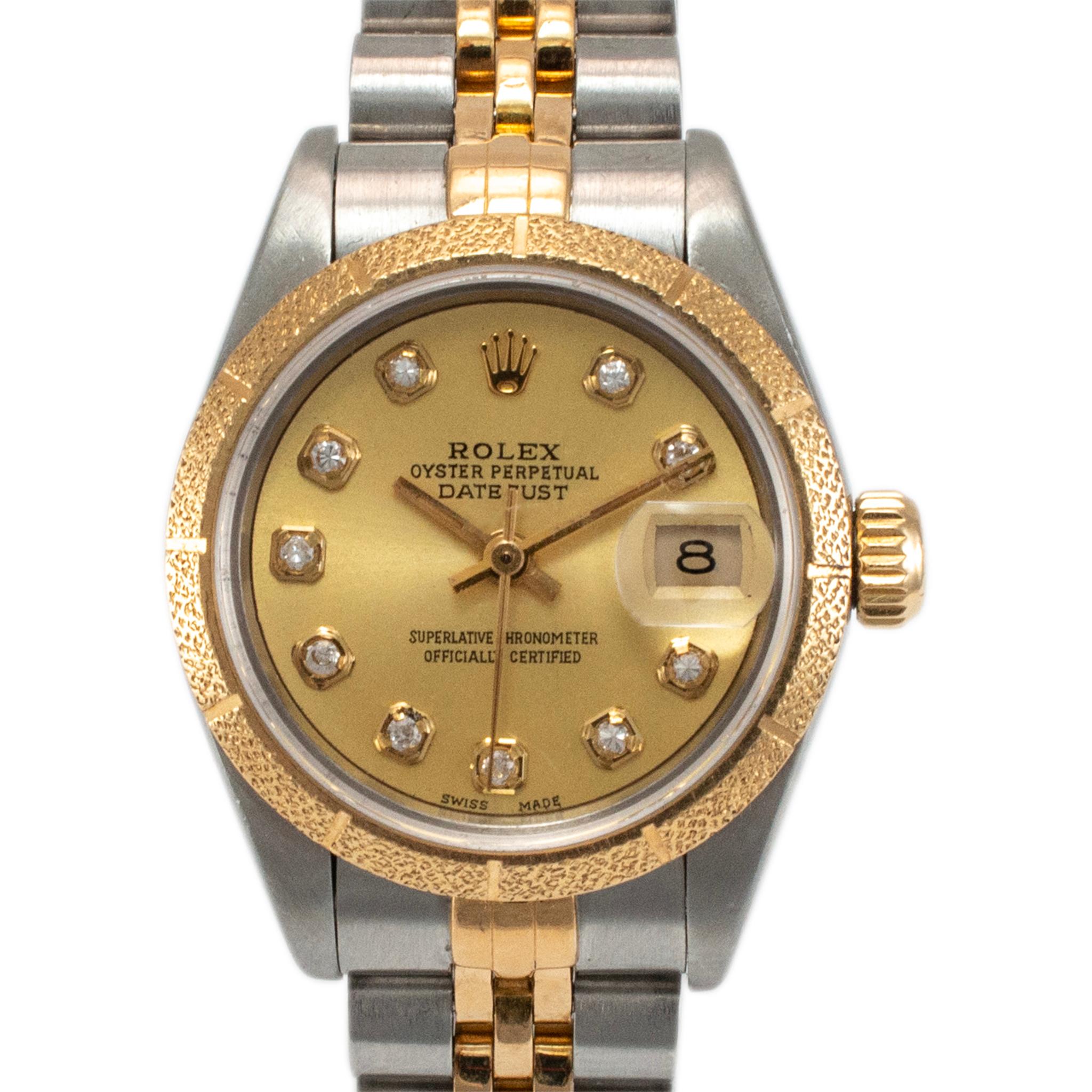 Brand: Rolex

Gender: Ladies

Metal Type: 18K Yellow Gold & Stainless Steel

Diameter: 26.00 mm

Weight: 52.28 Grams

Ladies 18K yellow gold and stainless steel ROLEX Swiss made watch. The metals were tested and determined to be 18K yellow gold and