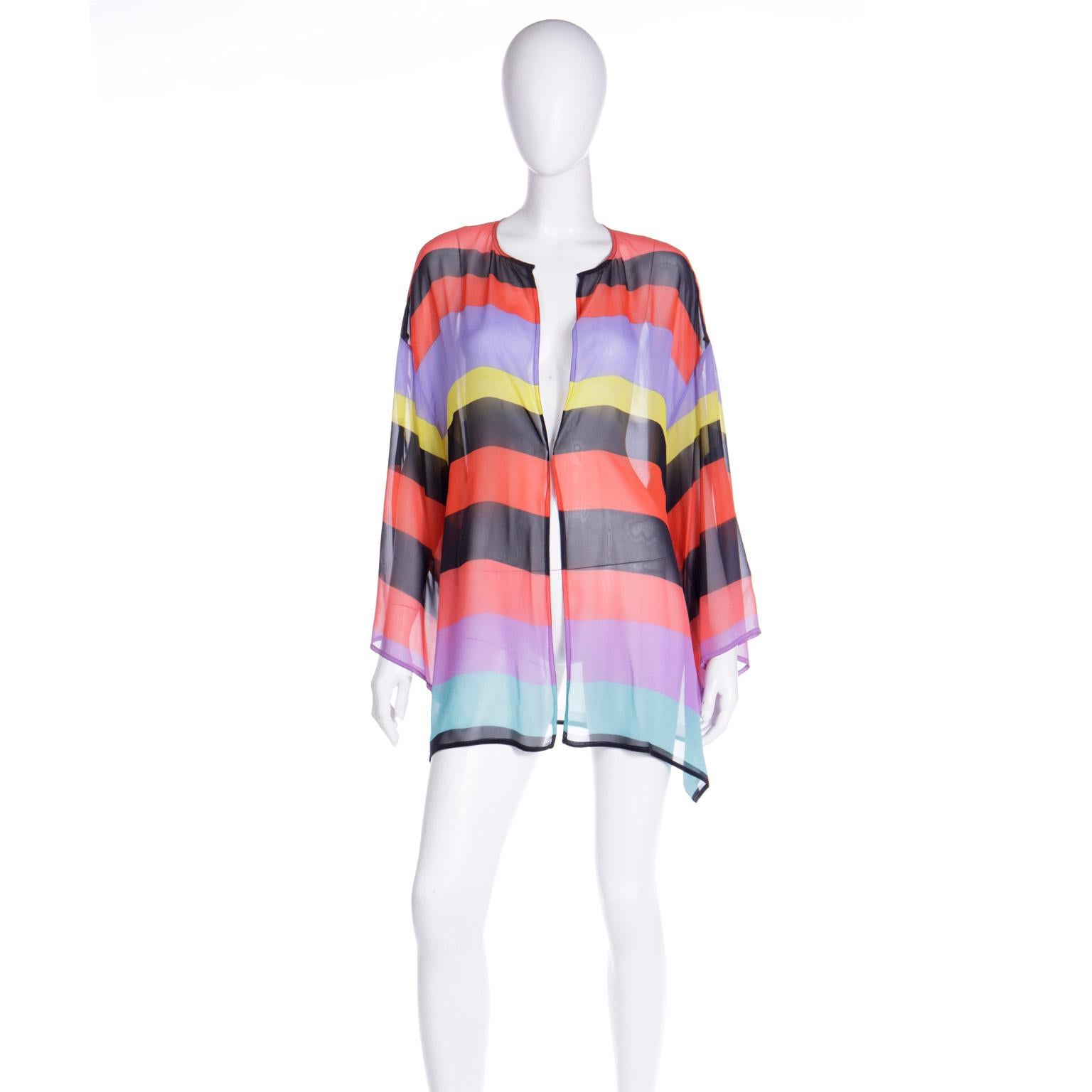 We are presenting a private collection of vintage Isaac Mizrahi clothing and accessories over the next month and this is part of that collection. This gorgeous sheer silk striped top is open in the front and in lovely shades of black, teal green,