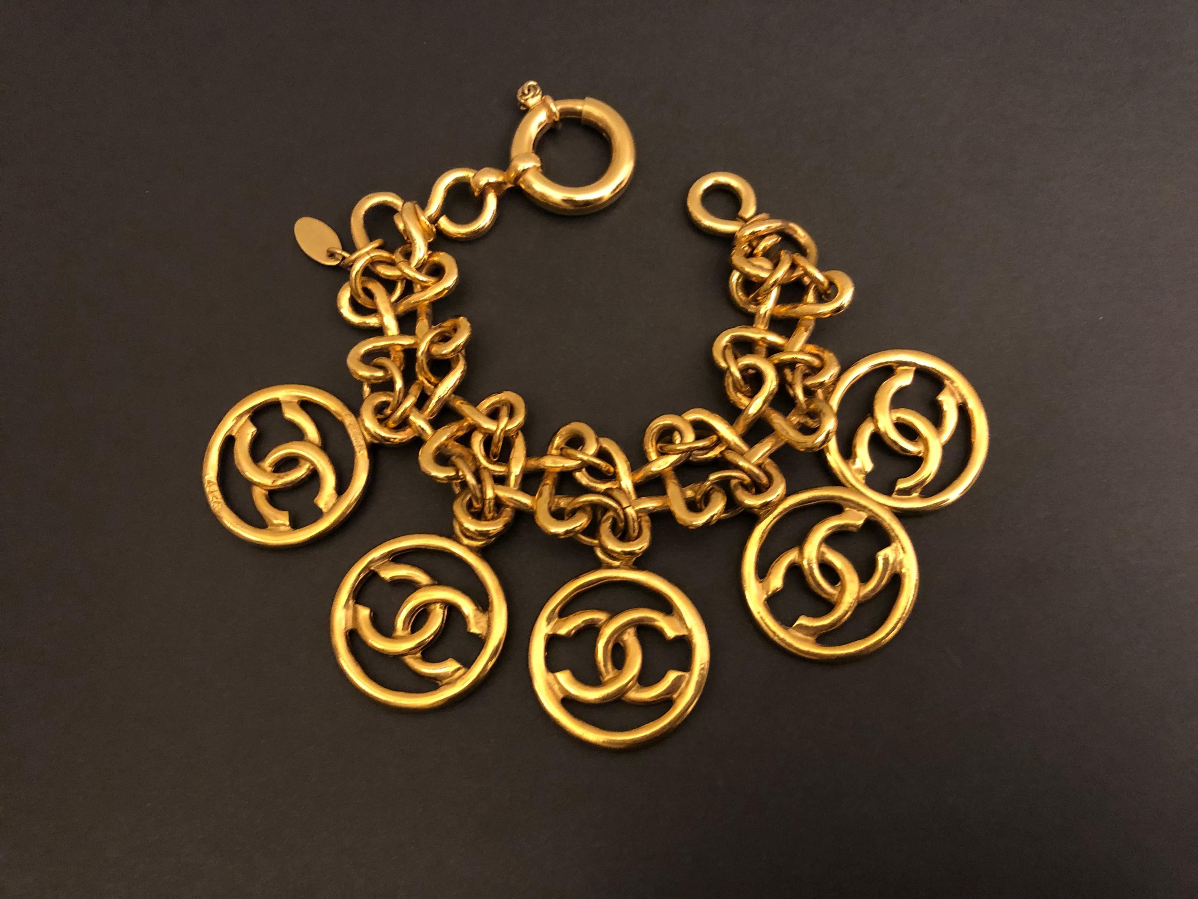 Vintage Chanel gold toned bracelet in clover links adorned with five CC charms. Absolutely a rare piece to add to your vintage collection. Length measures approximately 20 cm. Stamped 93P made in France. Comes with box.

Condition: In excellent