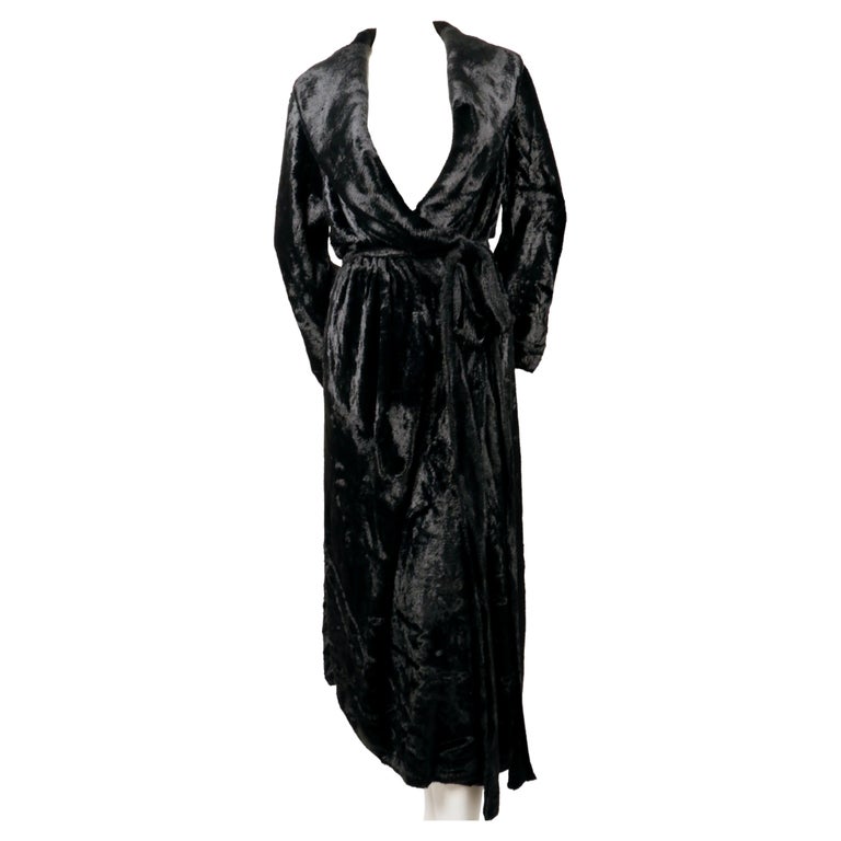 Very rare , jet-black, chenille robe coat with shawl collar and extra long belt designed by Azzedine Alaia dating to fall of 1994. Size XS but fits many sizes due to the oversized cut. Double button closure. Elasticized waist. Fabric content: 85%