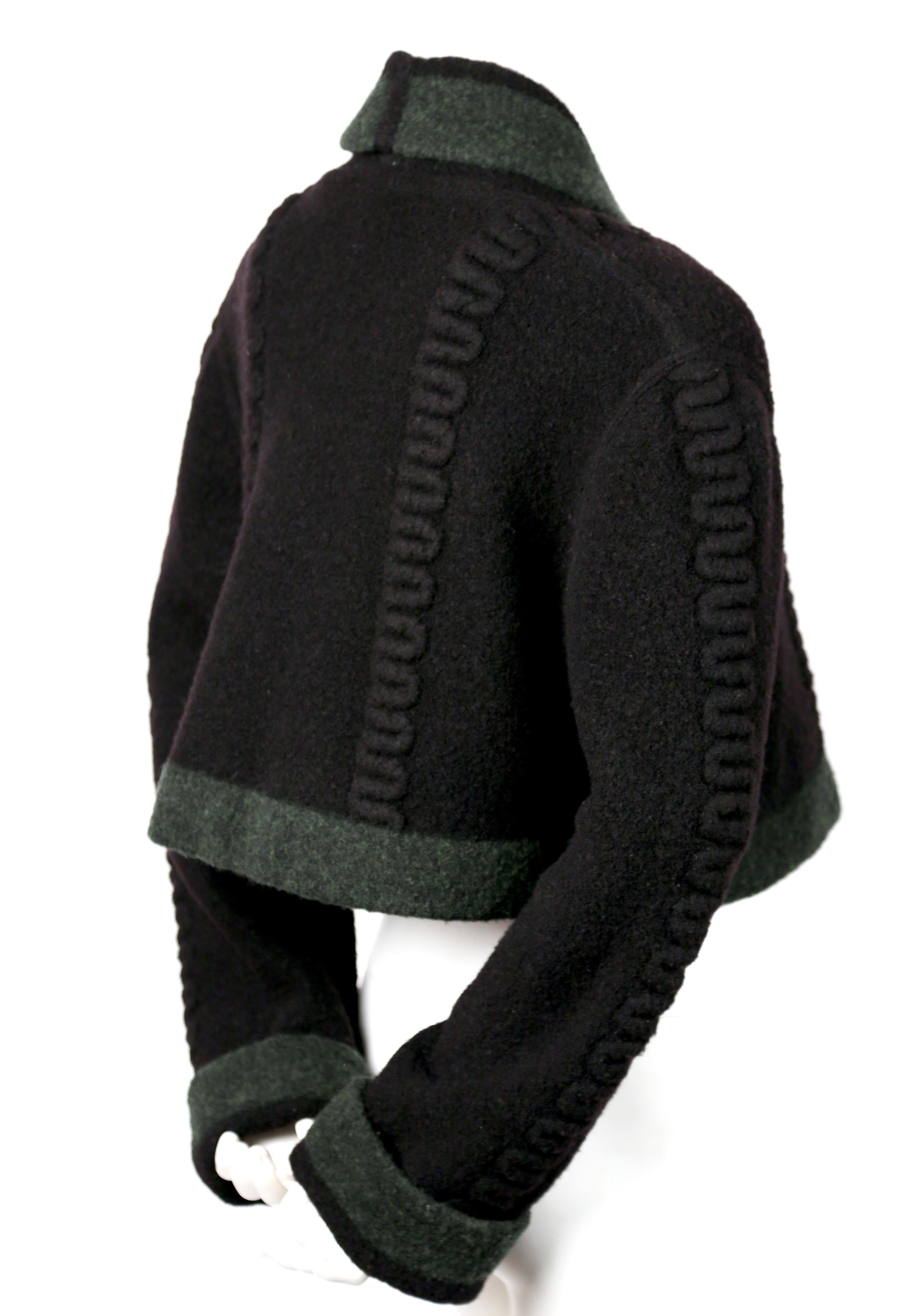 Deep navy-blue and green cropped wool cardigan sweater with raised weave and shell buttons designed by Azzedine Alaia dating to fall of 1994. Labeled a size 'S'. Approximate measurements: shoulder 17
