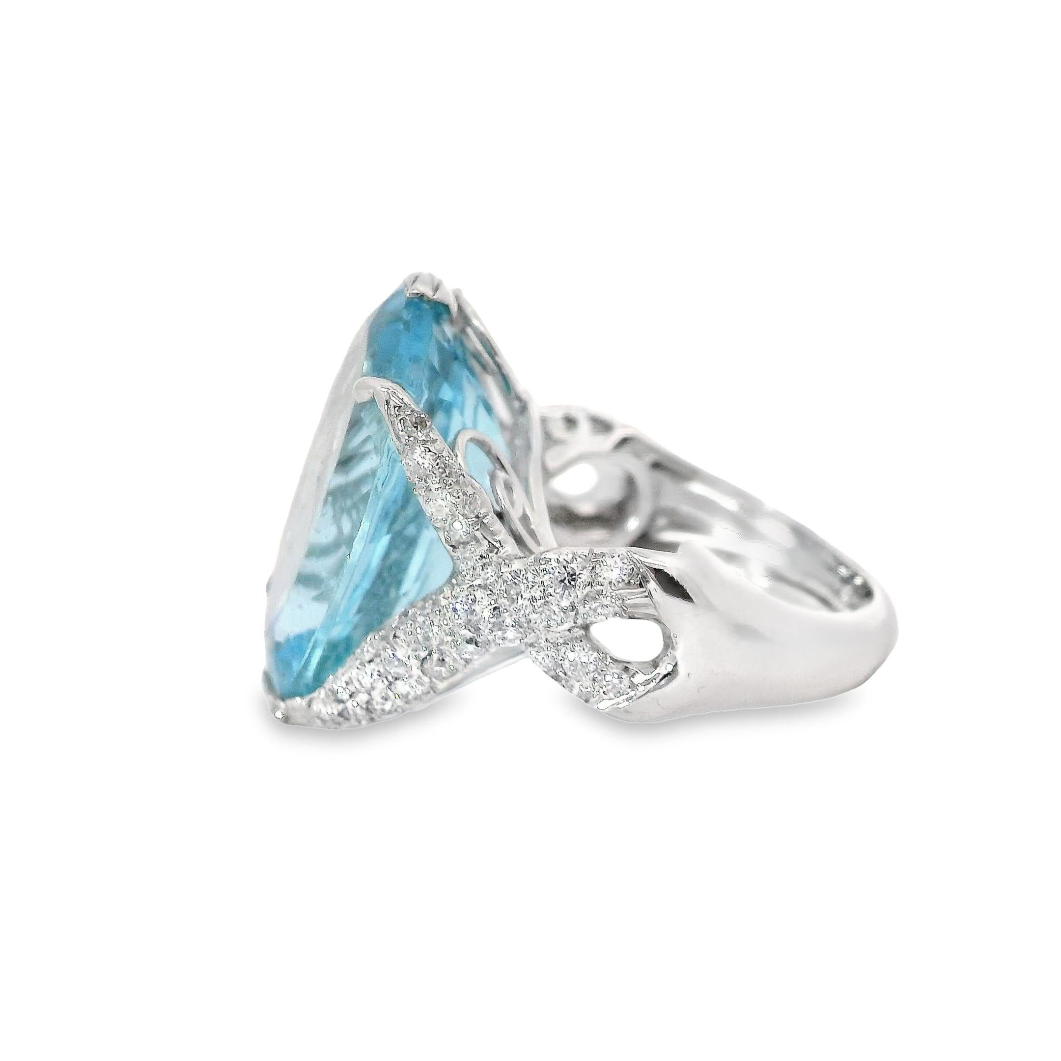 Dive into the depths of elegance with our stunning Blue Topaz Ring. Crafted with meticulous attention to detail, this exquisite piece features a breathtaking 19.94 carat oval blue Topaz that sparkles with the same enchanting beauty as the tranquil