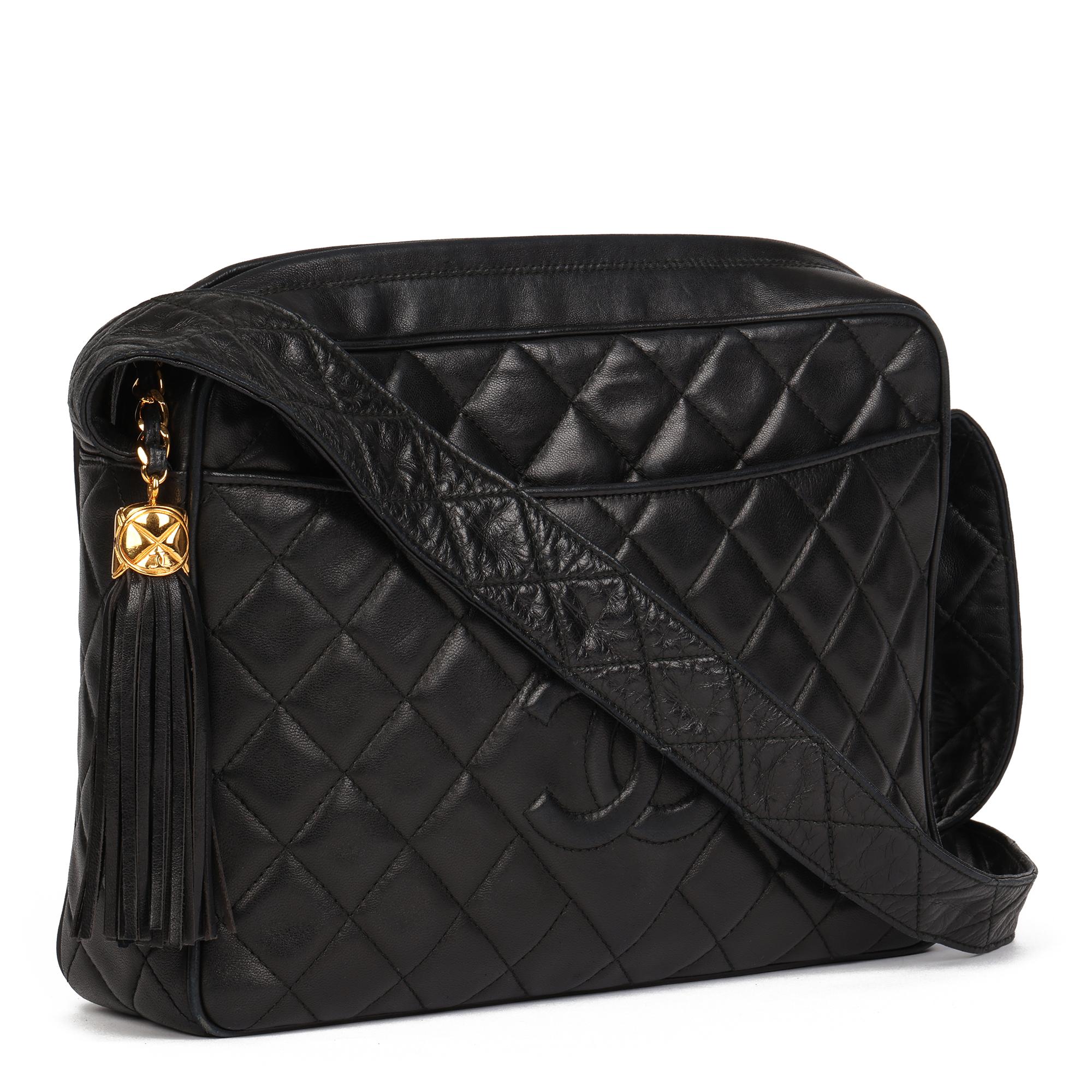 CHANEL
Black Quilted Lambskin Vintage Large Fringe Timeless Camera Bag 

Xupes Reference: HB4045
Serial Number: 2556891
Age (Circa): 1994
Accompanied By: Chanel Dust Bag, Authenticity Card 
Authenticity Details: Authenticity Card, Serial Sticker