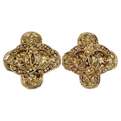 1994 Chanel Gold Tone CC Logo Baroque Cross Clip On Earrings