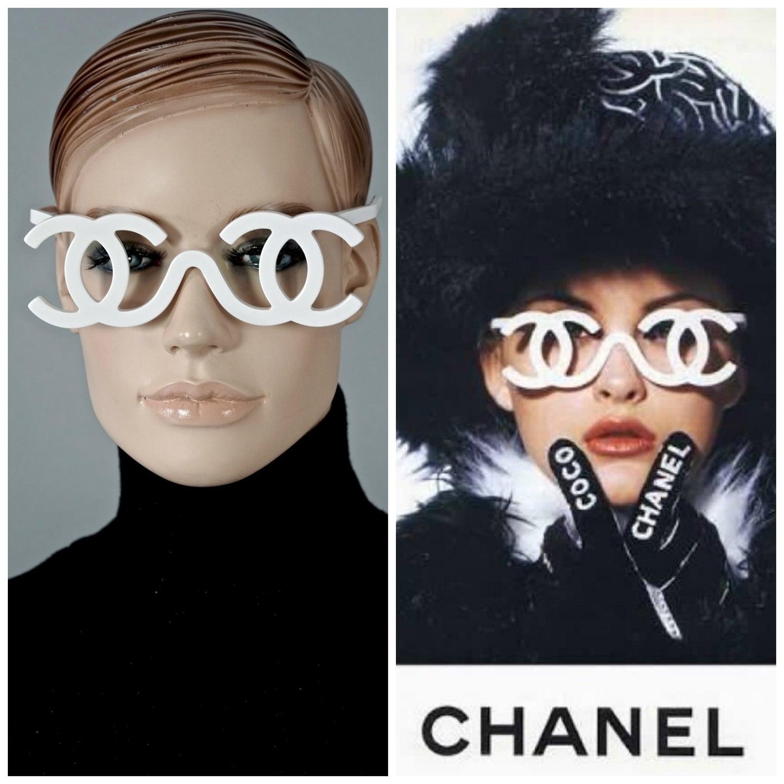 Measurements:
Height: 2 inches (5 cm)
Frame Width: 5.55 inches (14.1 cm)
Arm:  5.19 inches (13.2 cm)

Vintage Chanel Runway Fall / Winter 1994 sunglasses.

Features:
- 100% Authentic Vintage CHANEL. 
- White openwork CC logo frame with no lenses.
-