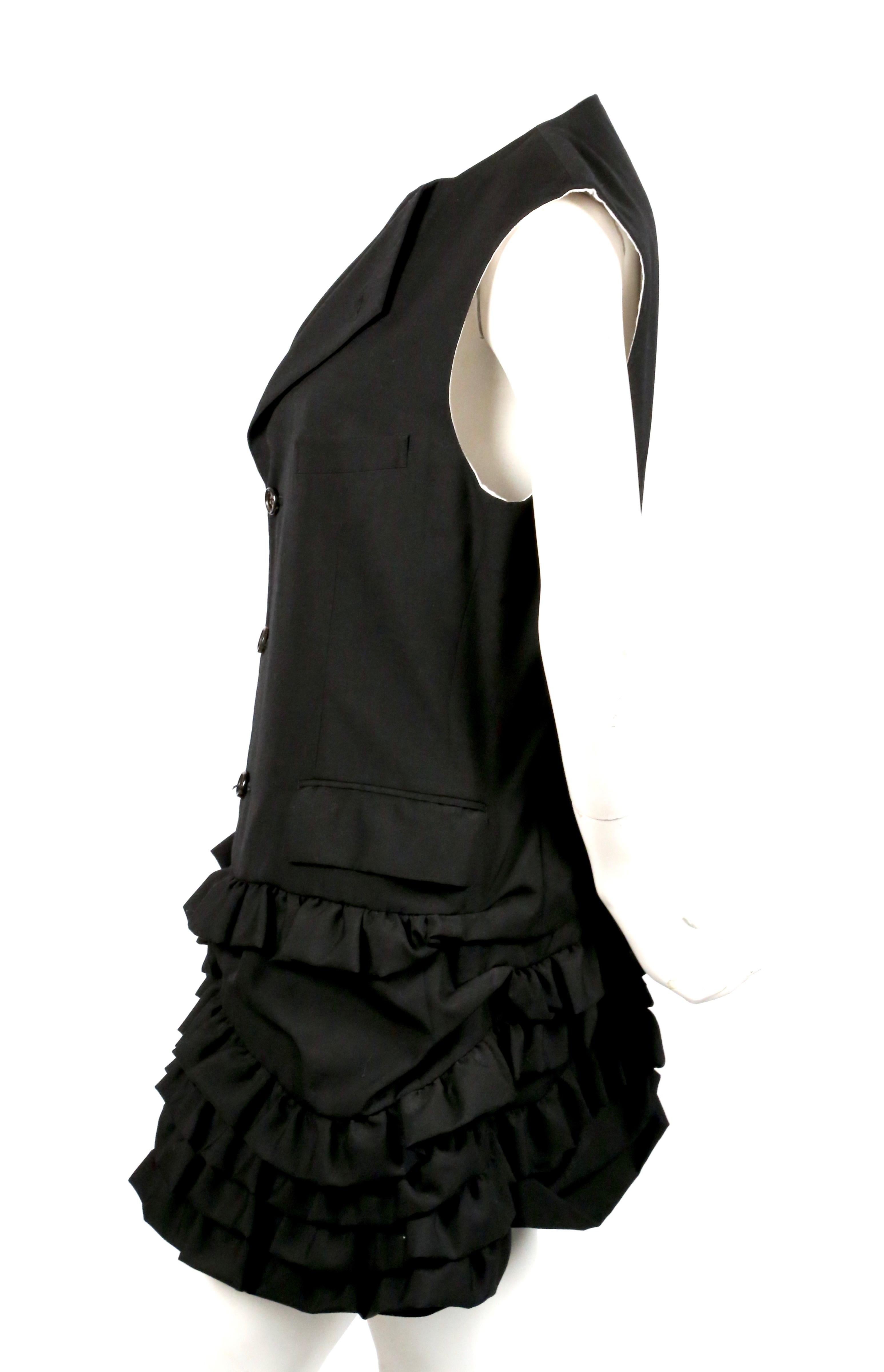 Jet-black, wool 'menswear' dress with ruffled skirting from Comme Des Garcons dating to 1994. Size 'S'. Approximate measurements: shoulder 15
