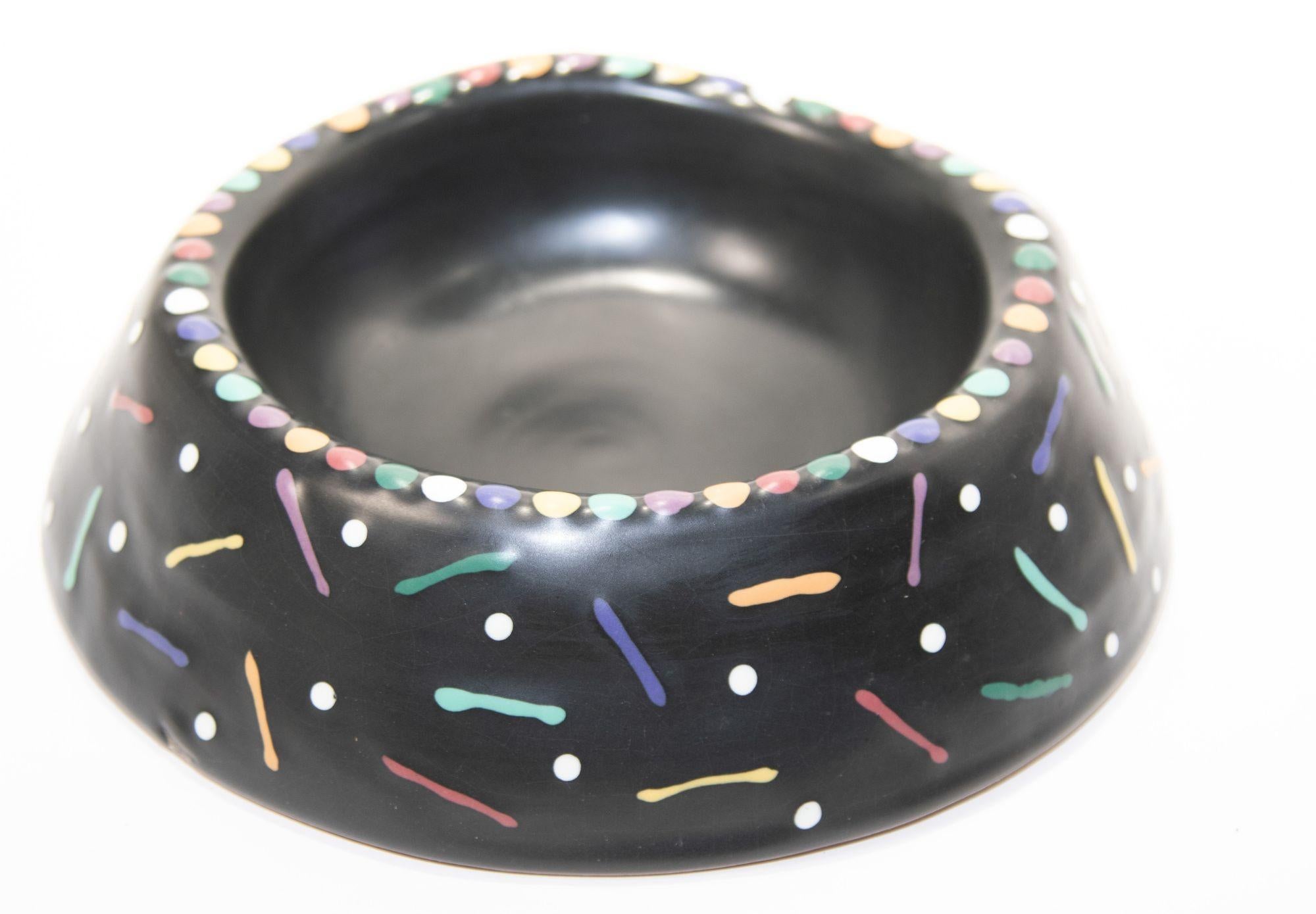 1994 Handcrafted ceramic bowl Signed by Luna Garcia.
Large ceramic bowl in black glazed with polychrome dots and marked with a large inscription 