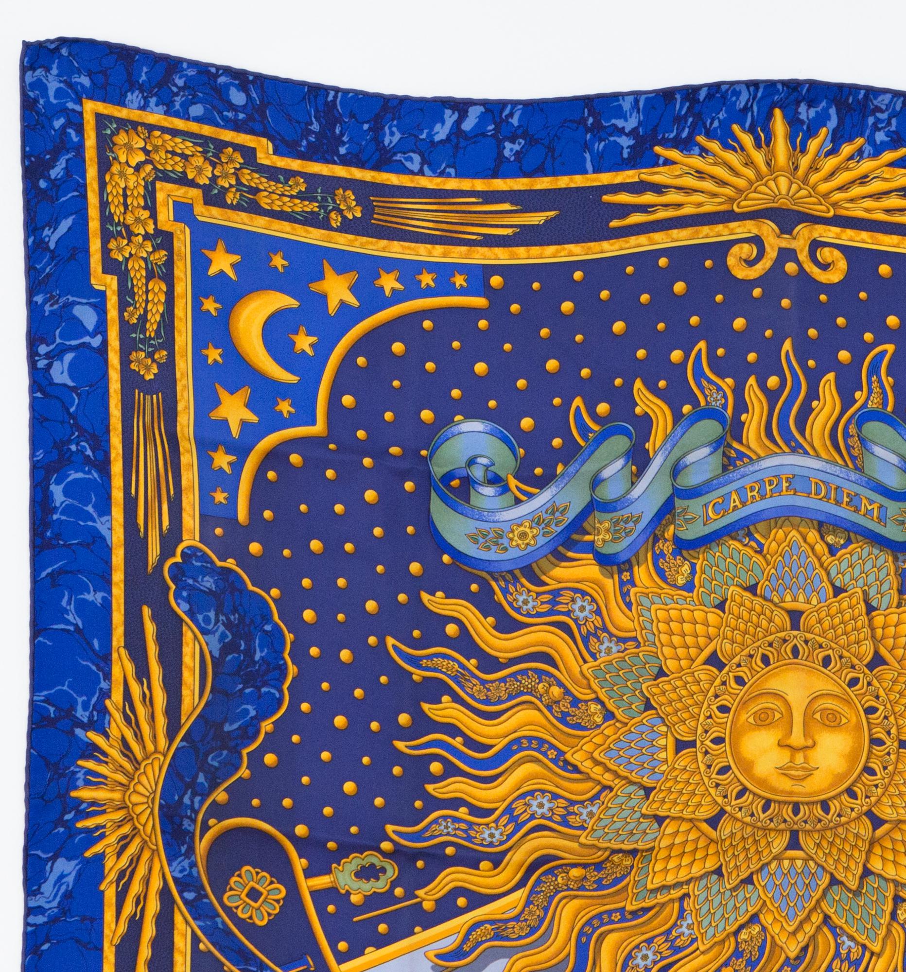 1994s Hermes blue Carpe Diem by Joachim Metz silk scarf  featuring  a sun motive.
In excellent vintage condition. Made in France.
35,4in. (90cm) X 35,4in. (90cm)
We guarantee you will receive this  iconic item as described and showed on