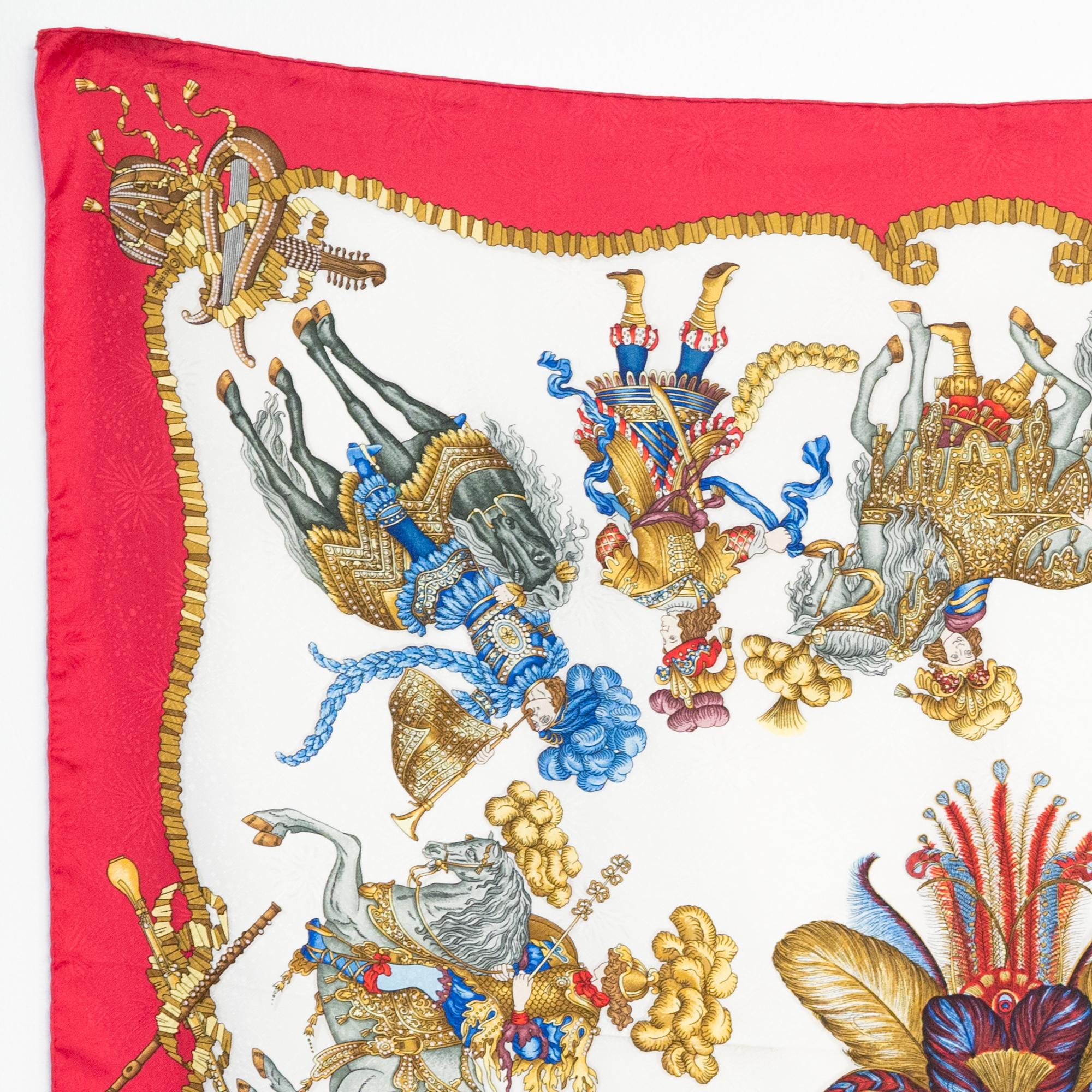 Hermes silk scarf Les Fetes du Roi Soleil by Caty Latham featuring a jacquard ground, a red border and a Hermès signature. 
First issue 1994
In good vintage condition. Made in France.
35,4in. (90cm)  X 35,4in. (90cm)
We guarantee you will receive