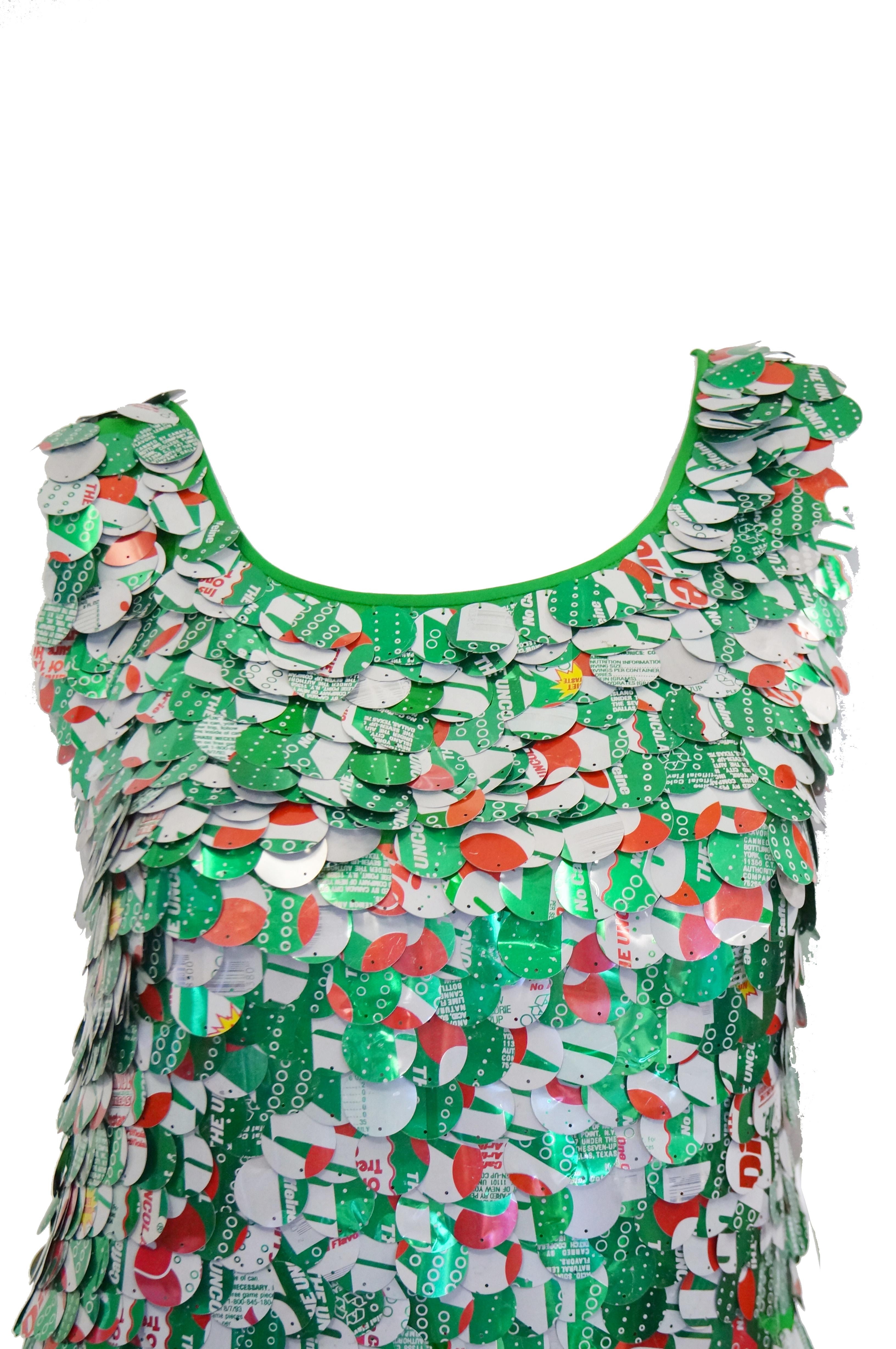 Countless green aluminium Diet 7-up Paillettes cover this silk kelly green shift mini dress. Pailletts chime when moved. Slips over head.