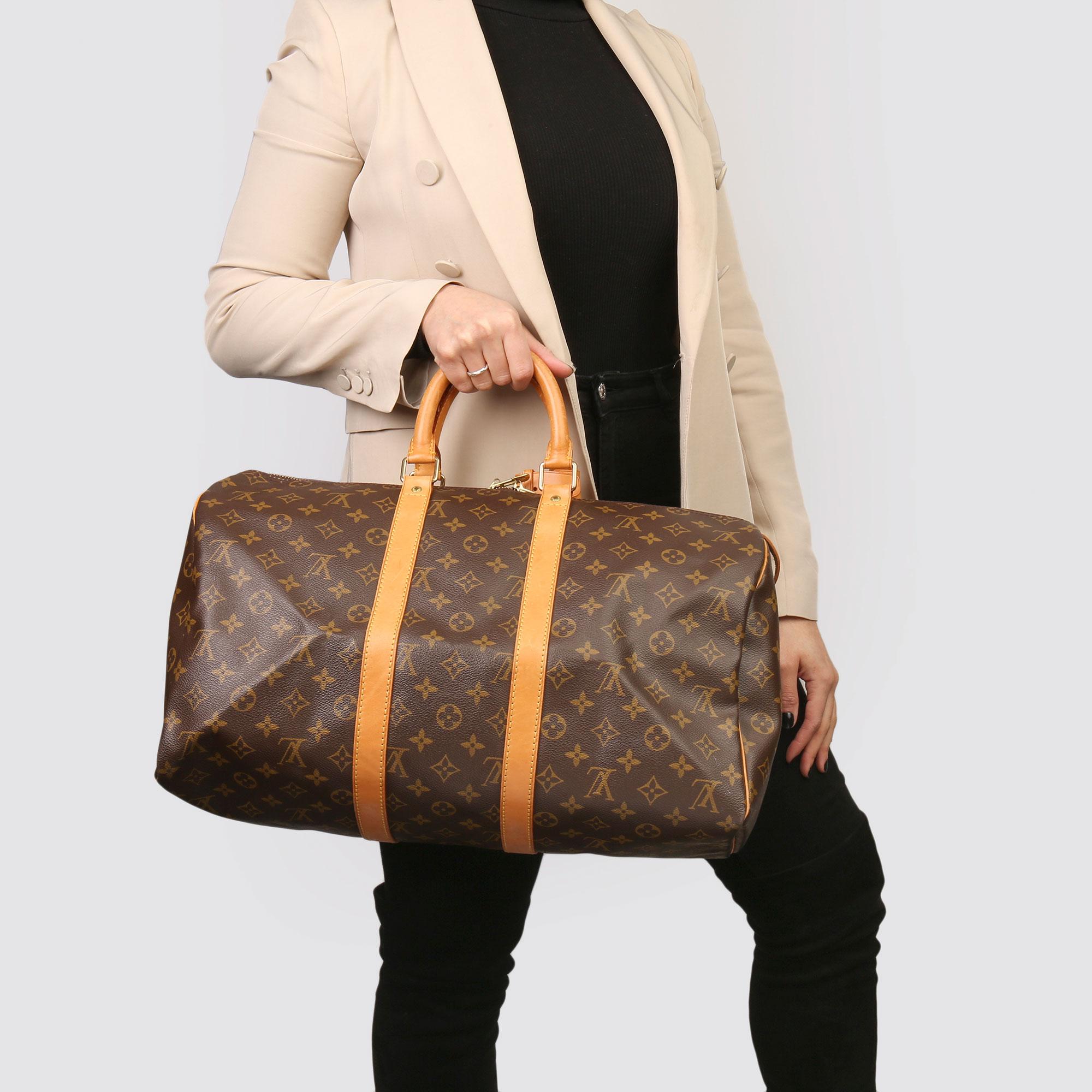 LOUIS VUITTON
Brown Monogram Coated Canvas & Vachetta Leather Vintage Keepall 45

Xupes Reference: HB3732
Serial Number: SP1904
Age (Circa): 1994
Accompanied By: Luggage Tag, Handle Keeper, Padlock, Keys 
Authenticity Details: Date Stamp (Made in
