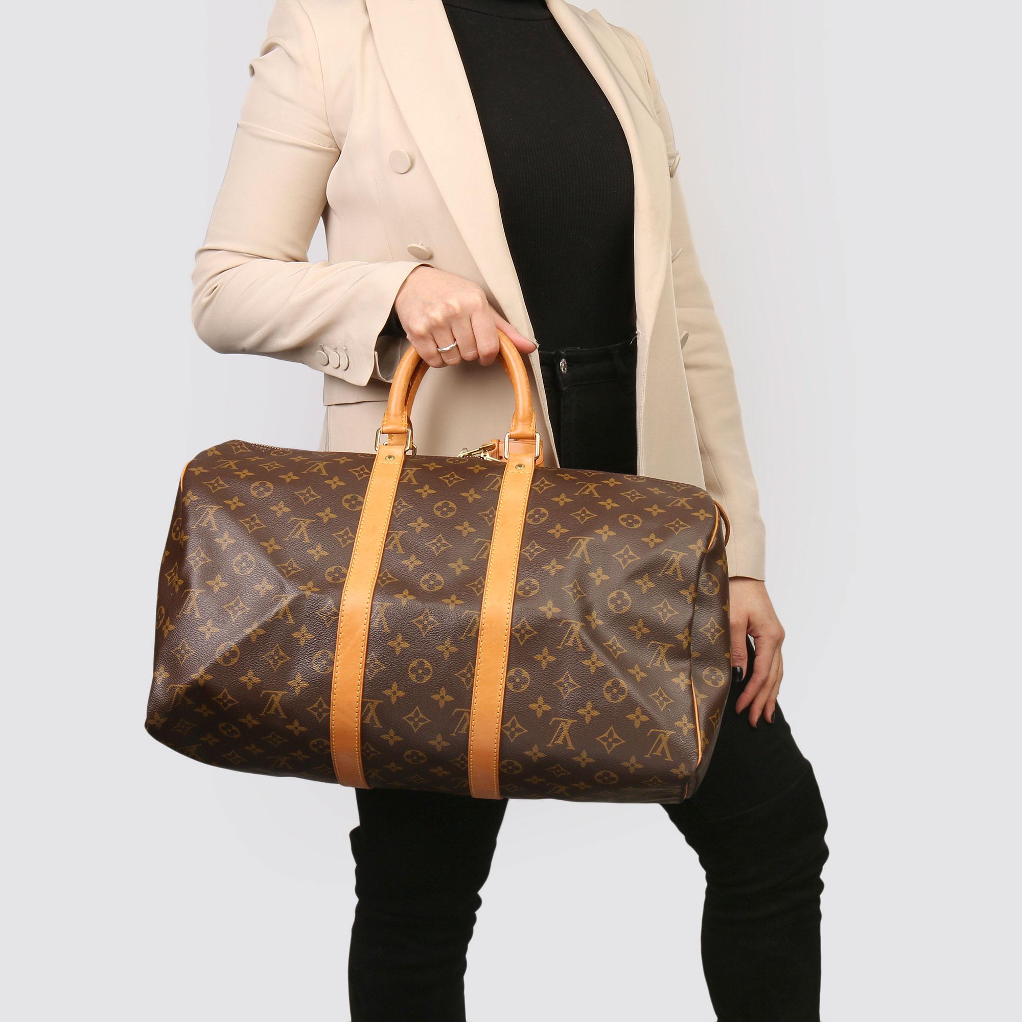 LOUIS VUITTON
Brown Monogram Coated Canvas & Vachetta Leather Vintage Keepall 45

Xupes Reference: HB3732
Serial Number: SP1904
Age (Circa): 1994
Accompanied By: Luggage Tag, Handle Keeper, Padlock, Keys 
Authenticity Details: Date Stamp (Made in
