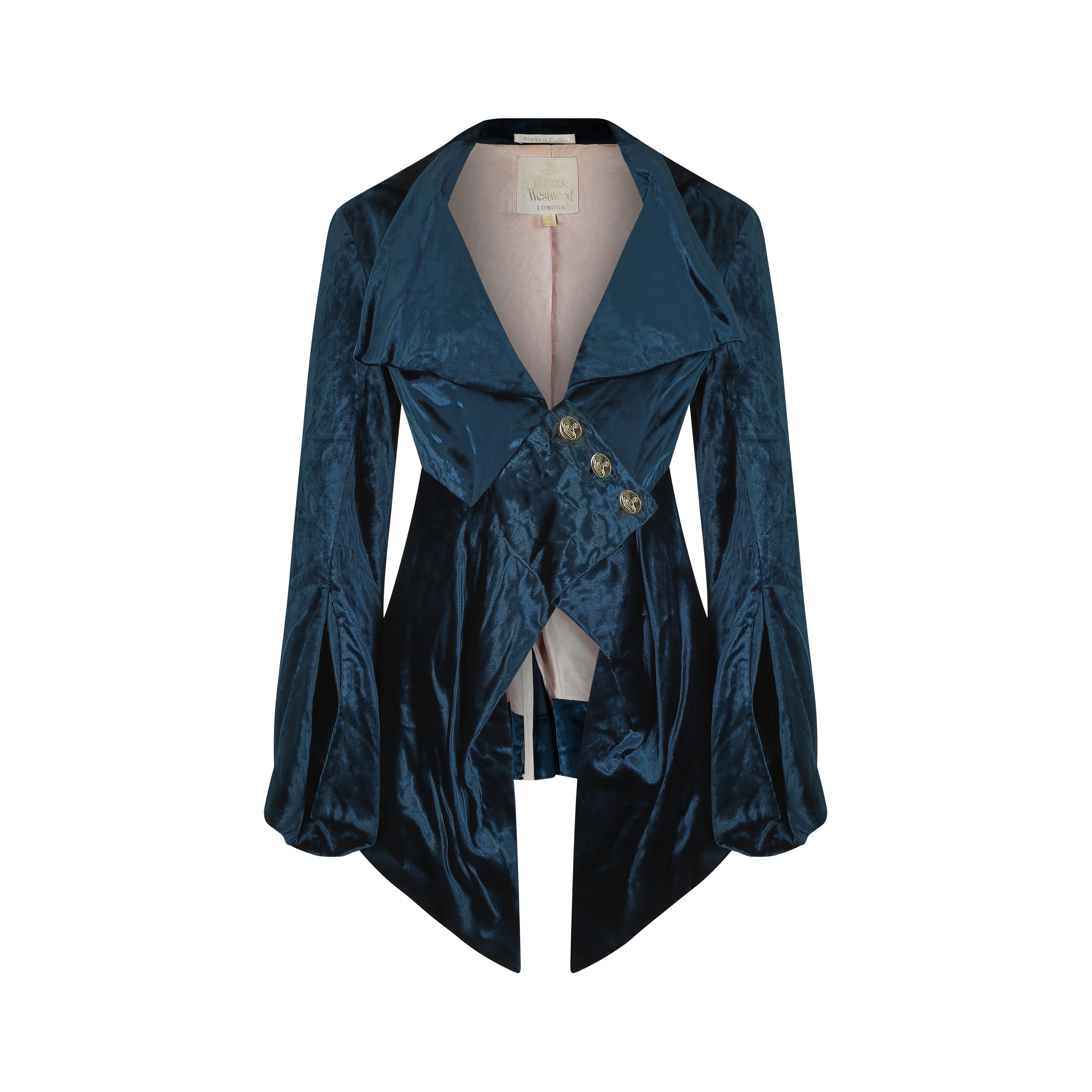 This incredible teal blue velvet couture frock coat by Vivienne Westwood is an excellent example of her interest in Victorian silhouettes and traditional 'dandy' styles. It featured heavily in her Fall/Winter 1994 collection, which came at the very