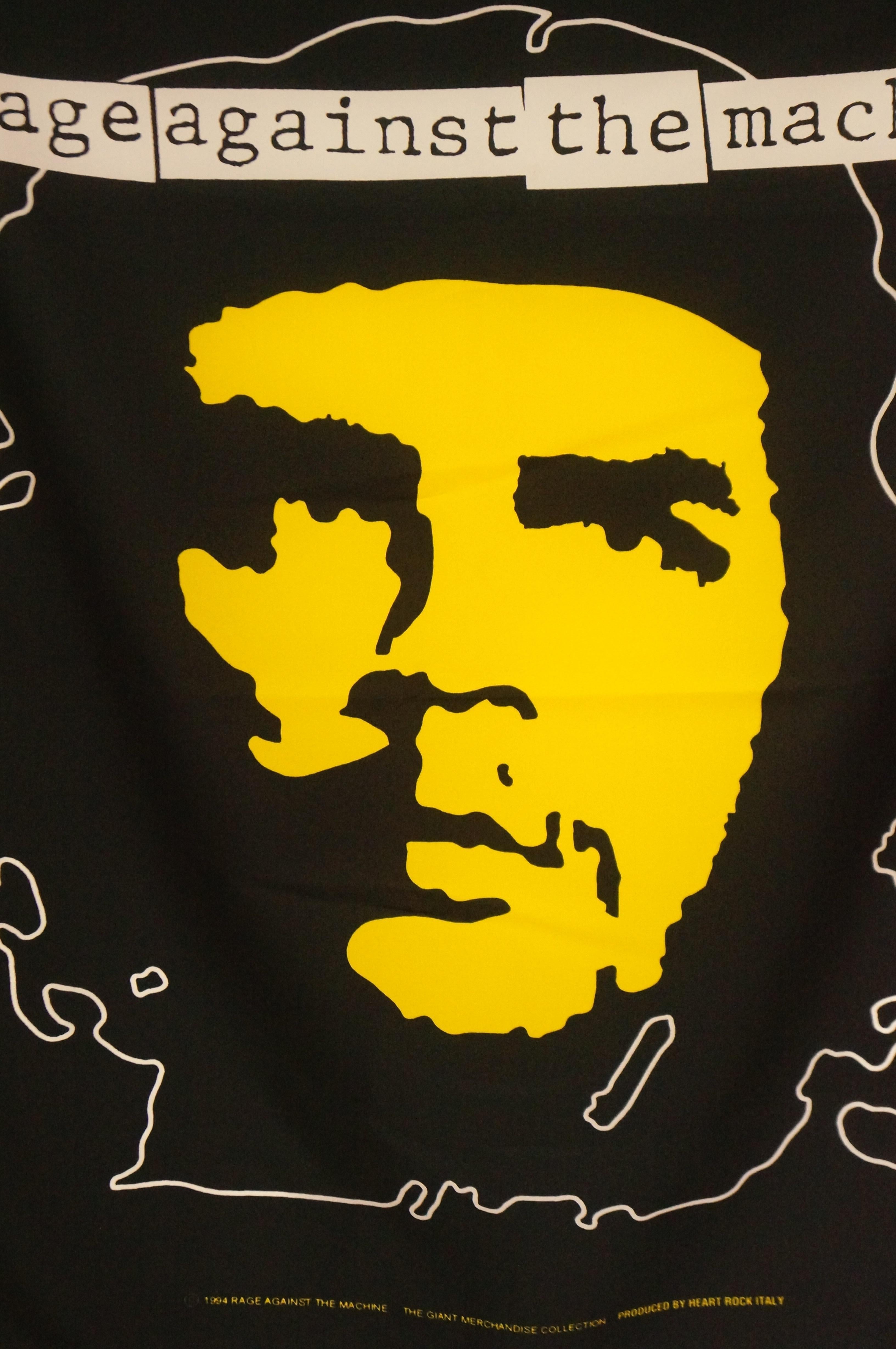 Rare 1994 Rage against the Machine wall flag scarf featuring a large graphic of Che Guevara. The scarf is primarily black with white and yellow screenprint graphics. The piece depicts Che Guevara in Alberto Korda's iconic 