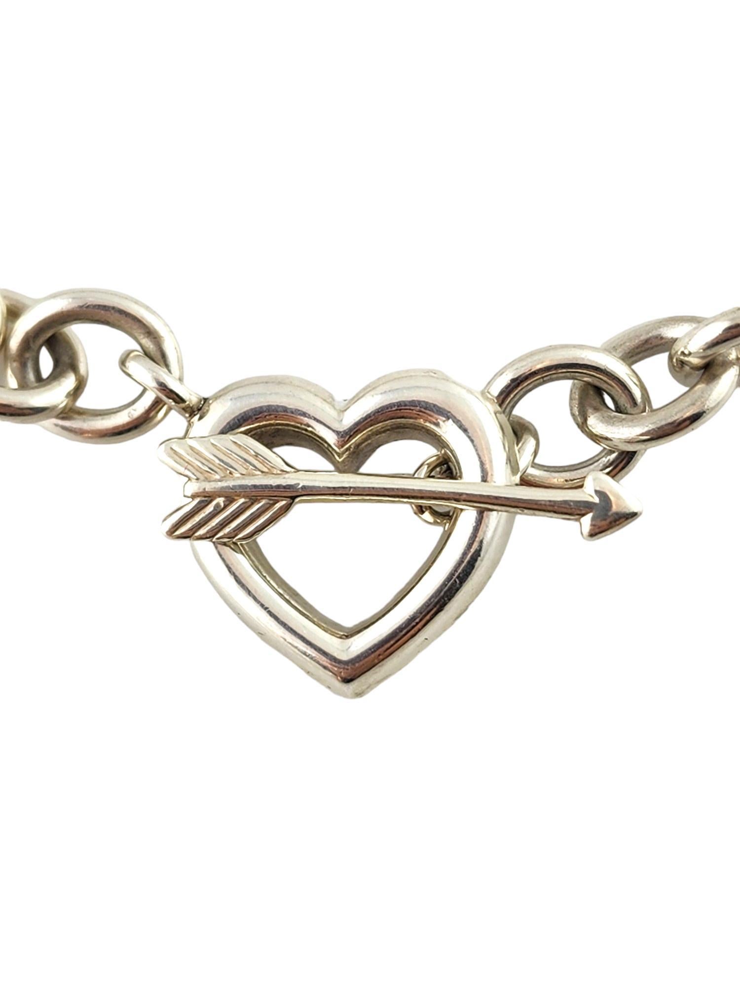 1994 Tiffany & Co Sterling Silver Heart Arrow Toggle Chain Link Necklace

This gorgeous toggle chain link necklace by Tiffany & Co was meticulously crafted from sterling silver and features a heart and arrow as the toggle pieces!

Chain length: