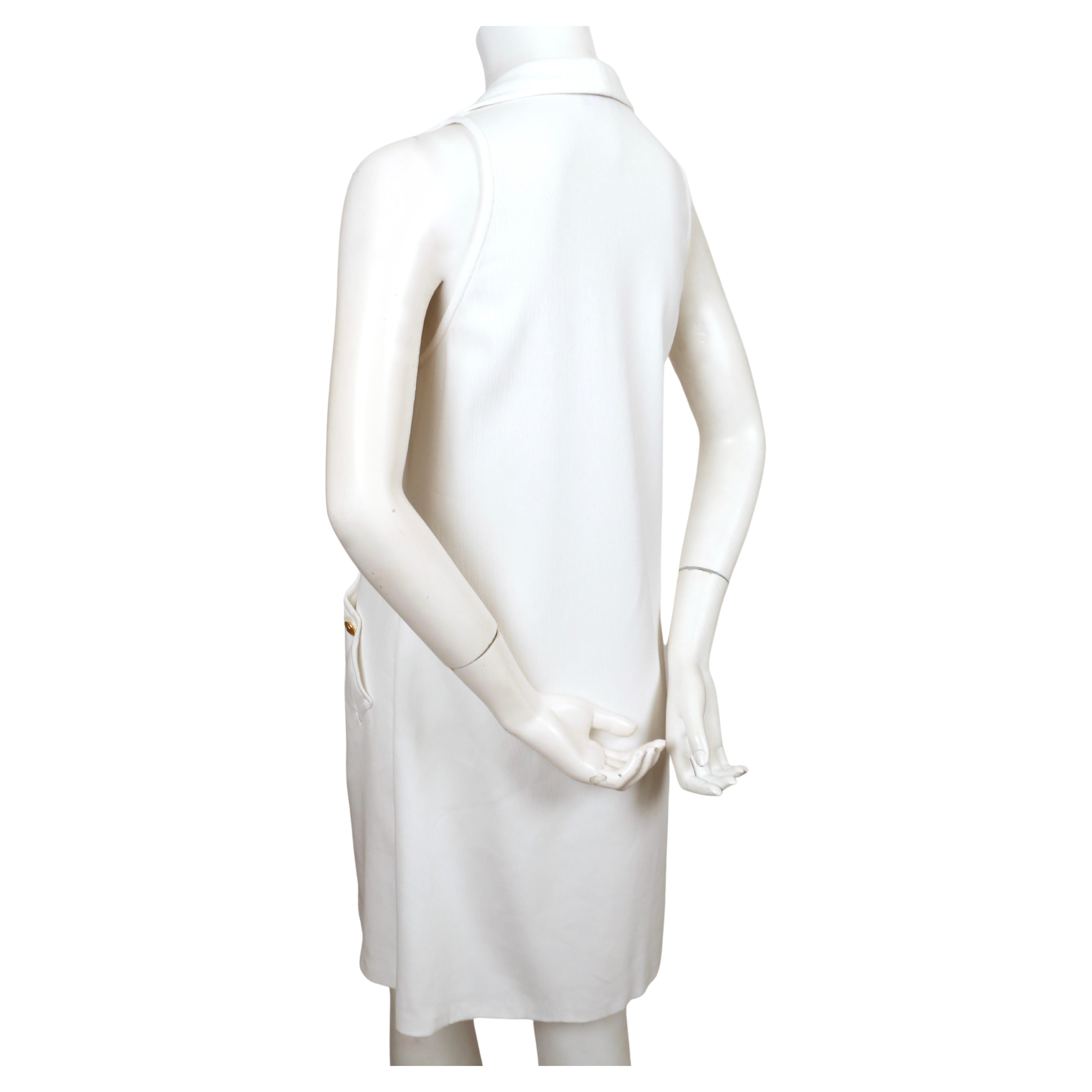 Very rare, ribbed white sleeveless dress with gold interlocking GG buttons designed by Tom Ford from Gucci dating to 1994.  No size is indicated however this best fits a US 2-6. Approximate measurements: bust 33', hips 38