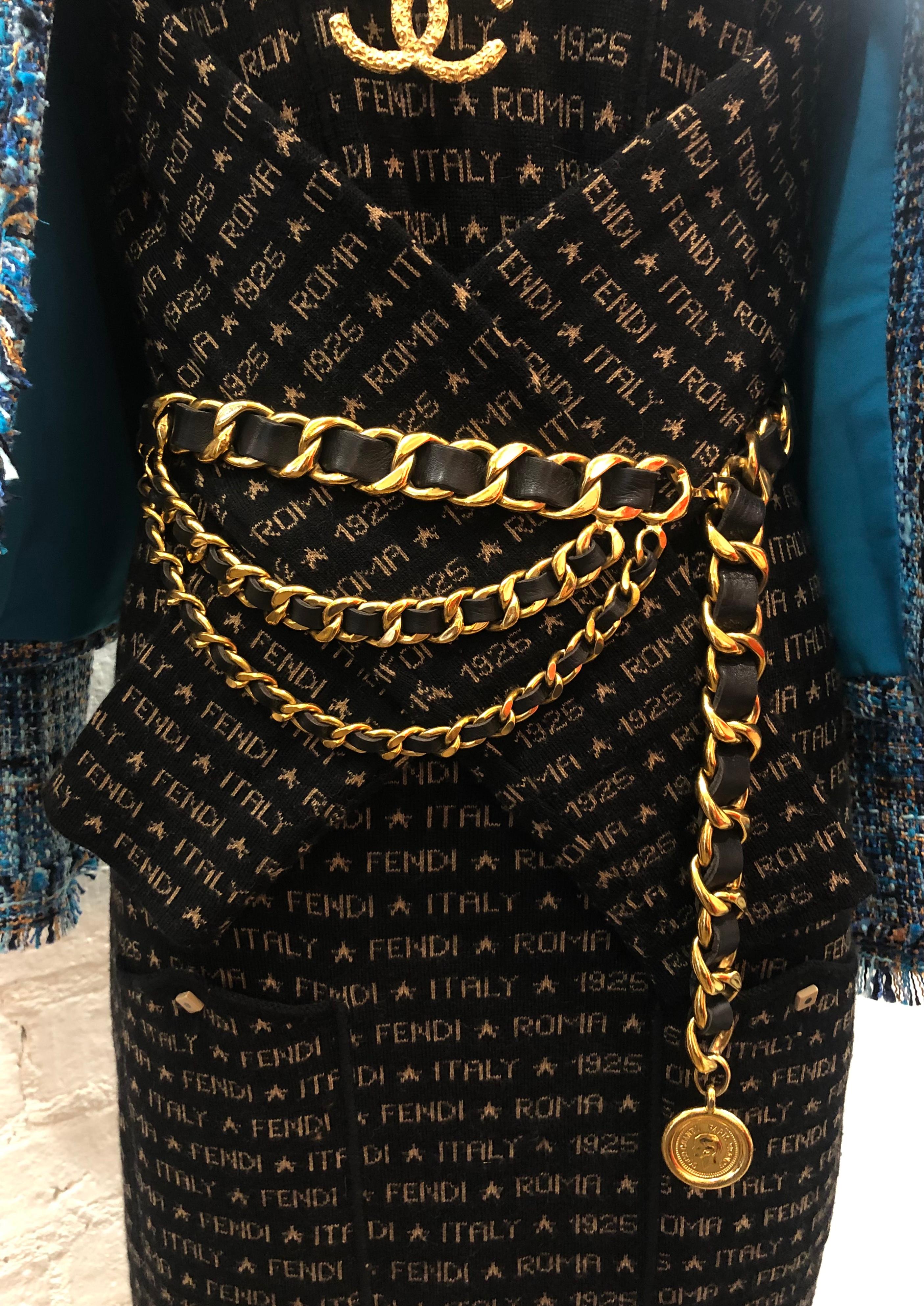 This vintage CHANEL chain belt is crafted of gold toned chains interlaced with black leather with triple chain draping featuring a Cambon coin charm. This statement Chanel chain belt was seen on runway in the 1990s. Stamped 94P CHANEL made in
