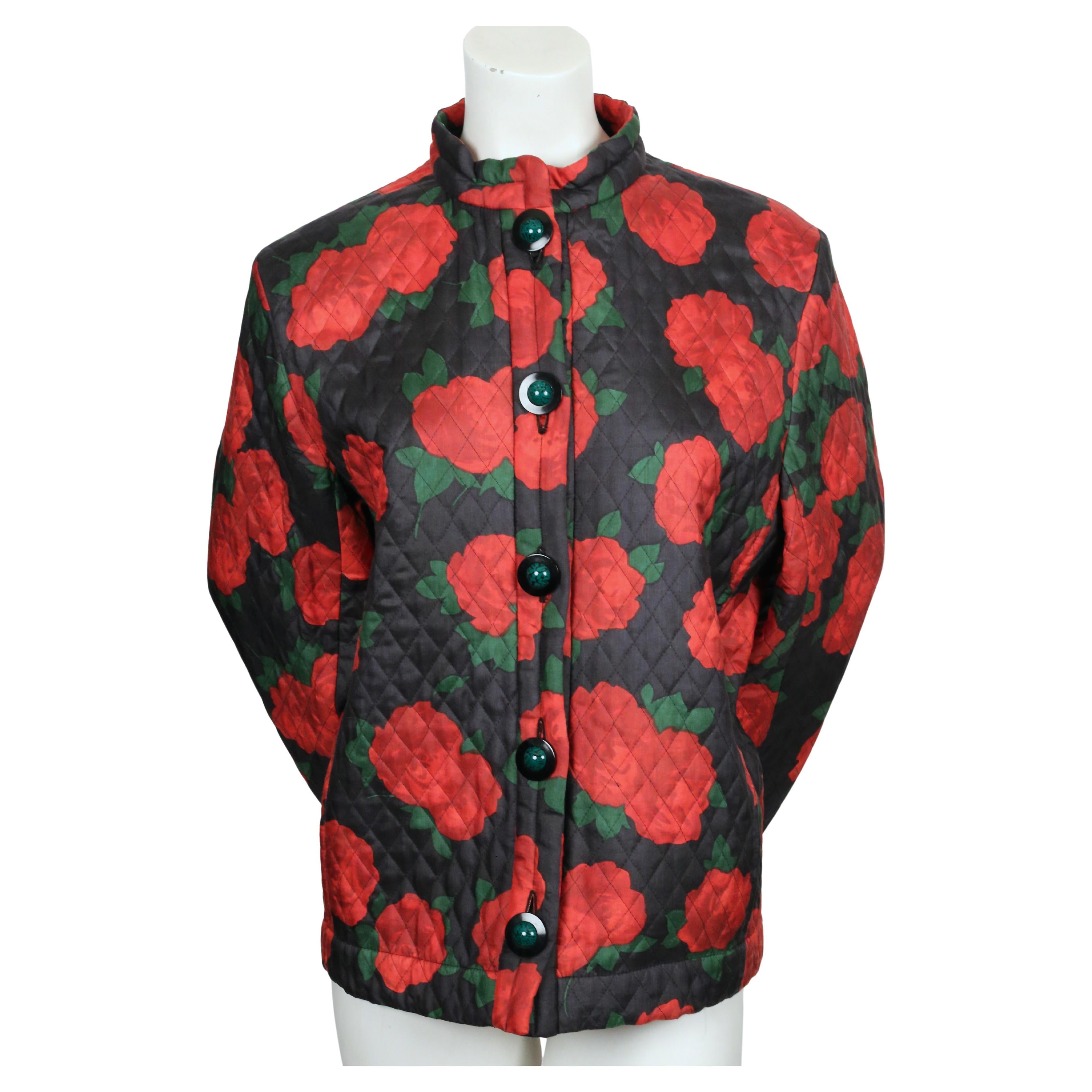 Vibrant, rose-printed silk jacket with quilting designed by Yves Saint Laurent dating to Fall of 1994 exactly as seen on the runway. The jacket features a boxy cut with a stand-up collar, hidden side pockets and closes with amazing black and green