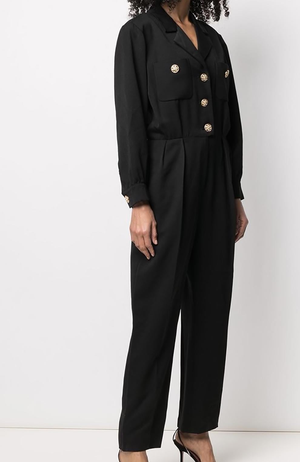 1994 Yves Saint Laurent YSL black evening jumpsuit featuring front jewel buttons, sides pockets, front patch pockets, shoulder pads.
100% Wool
Estimated size 40fr/US8/UK12 
In good vintage condition. 
Made in France. 
We guarantee you will receive