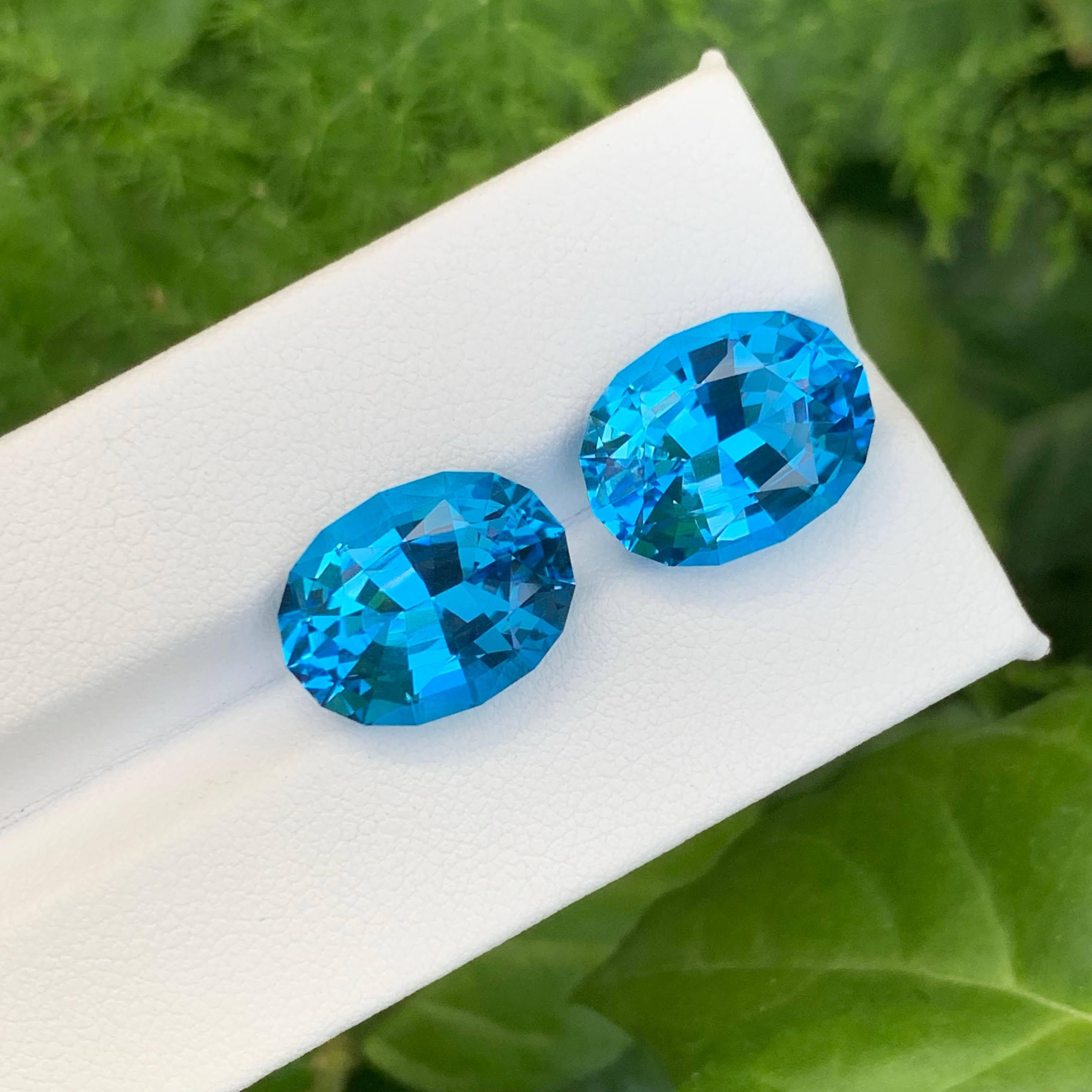Moderno 19,95 Carati di Topazio Blu Neon Naturale Sciolto Coppia Taglio Ovale Gemma del Madagascar in vendita
