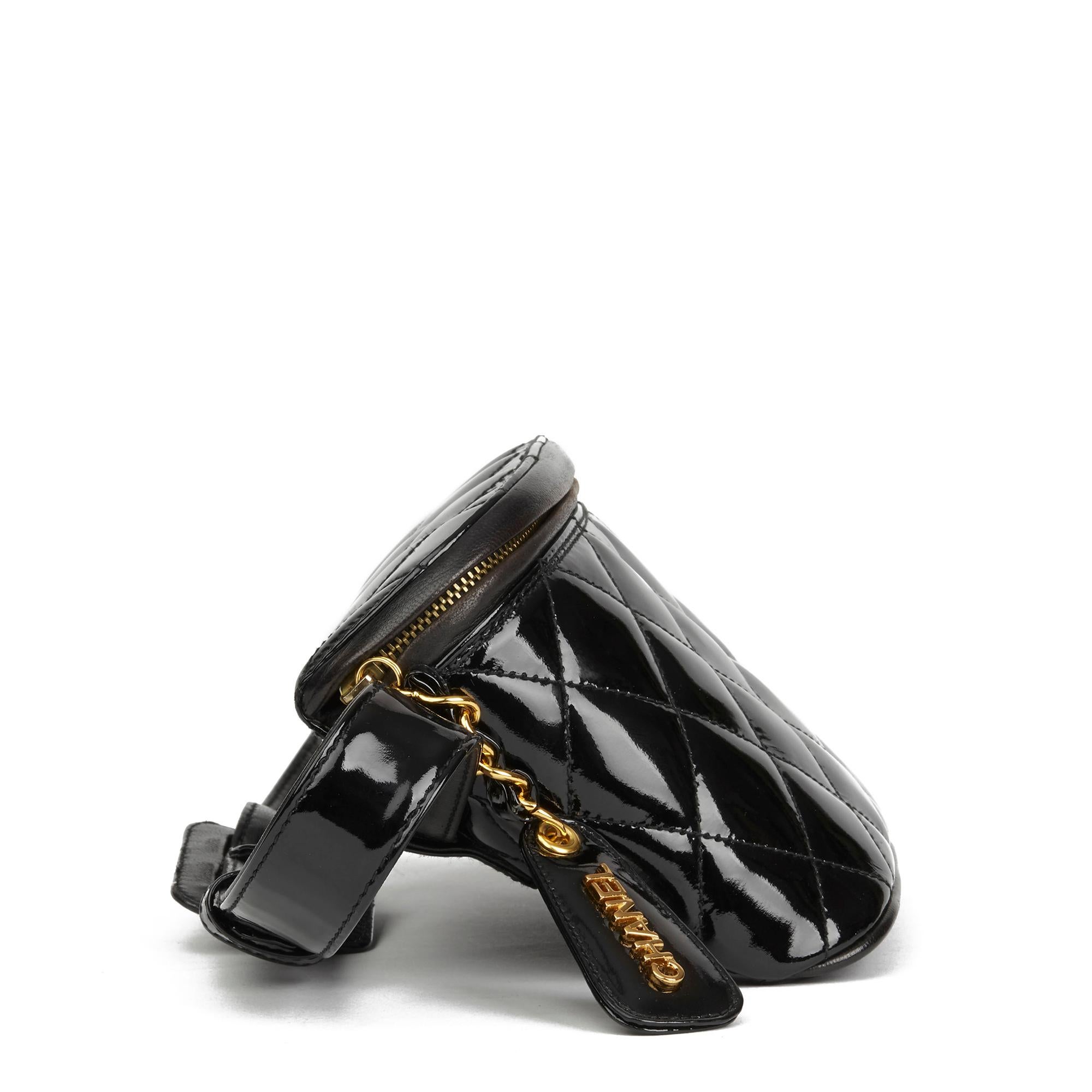 CHANEL
Black Quilted Patent Leather Vintage Timeless Belt Bag

 Reference: HB2880
Serial Number: 3845475
Age (Circa): 1995
Accompanied By: Chanel Box
Authenticity Details: Serial Sticker (Made in Italy)
Gender: Ladies
Type: Belt Bag

Colour: