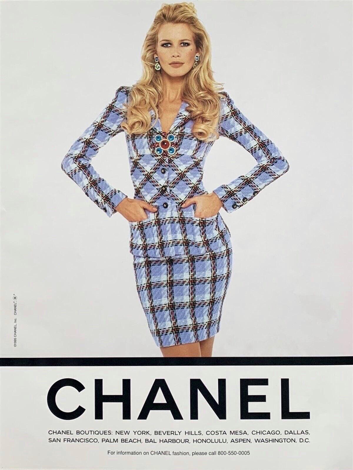 A highly coveted and instantly recognizable Chanel periwinkle plaid boucle wool two-piece suit from Karl Lagerfeld's epic 1995 spring/summer collection. This gorgeous plaid jacket and skirt set was runway look #32 modeled by the stunning Patricia