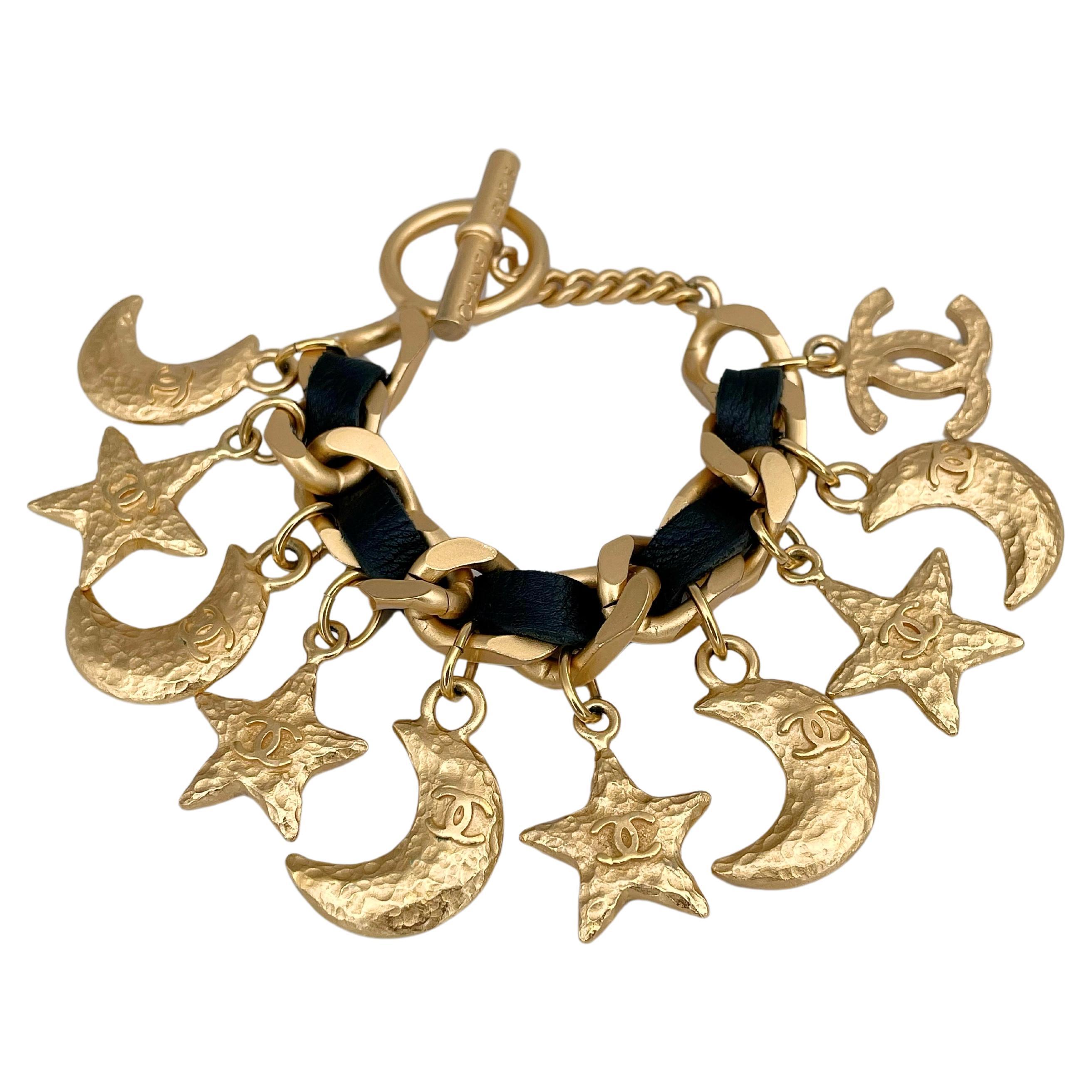 1995 Chanel Gold Tone CC Logo Moon Star Black Leather Charm Bracelet For Sale
