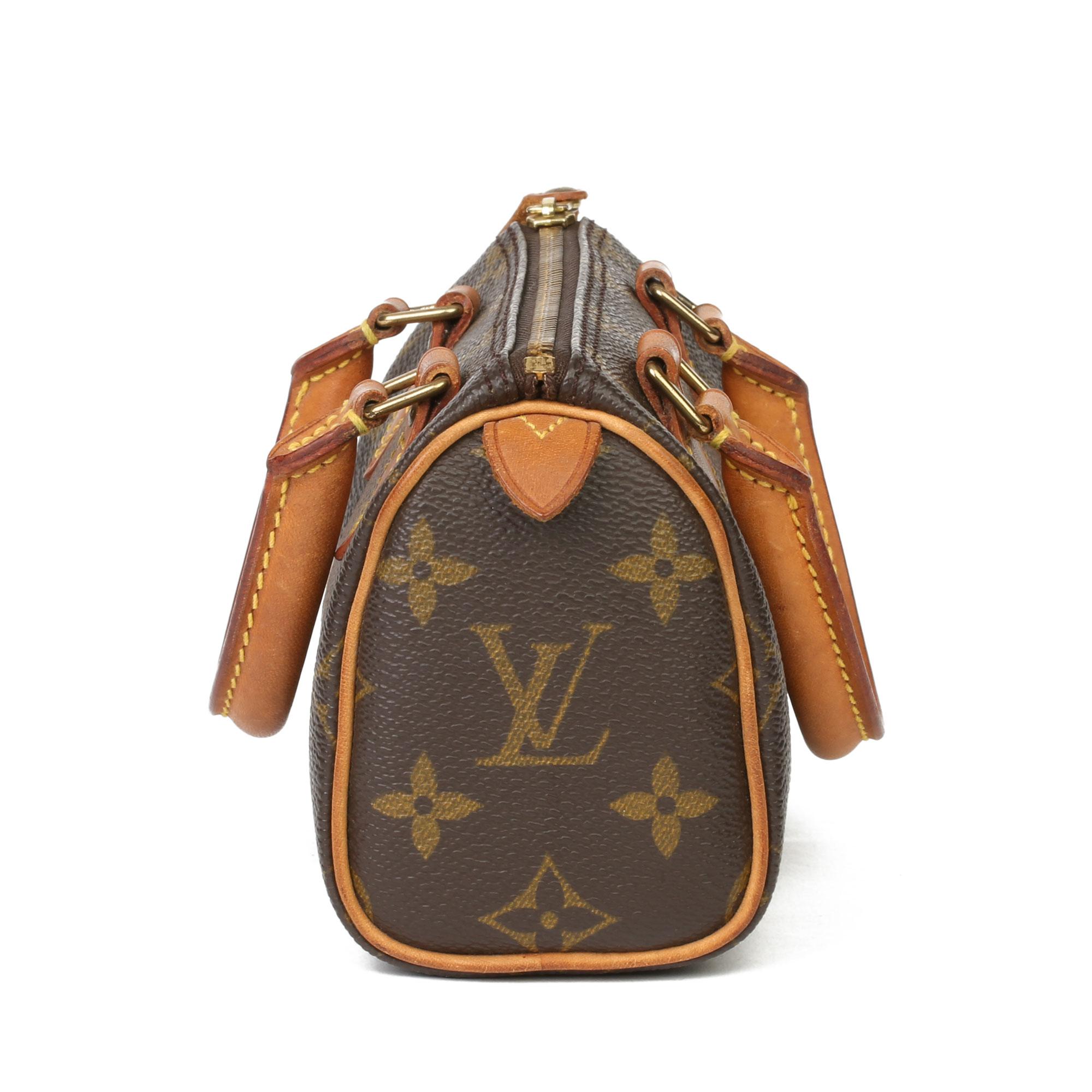 LOUIS VUITTON
Brown Monogram Coated Canvas & Vachetta Leather  Vintage Mini HL Speedy

Xupes Reference: HB3867
Serial Number: TH1915
Age (Circa): 1995
Authenticity Details: Date Stamp (Made in France) 
Gender: Ladies
Type: Tote

Colour: