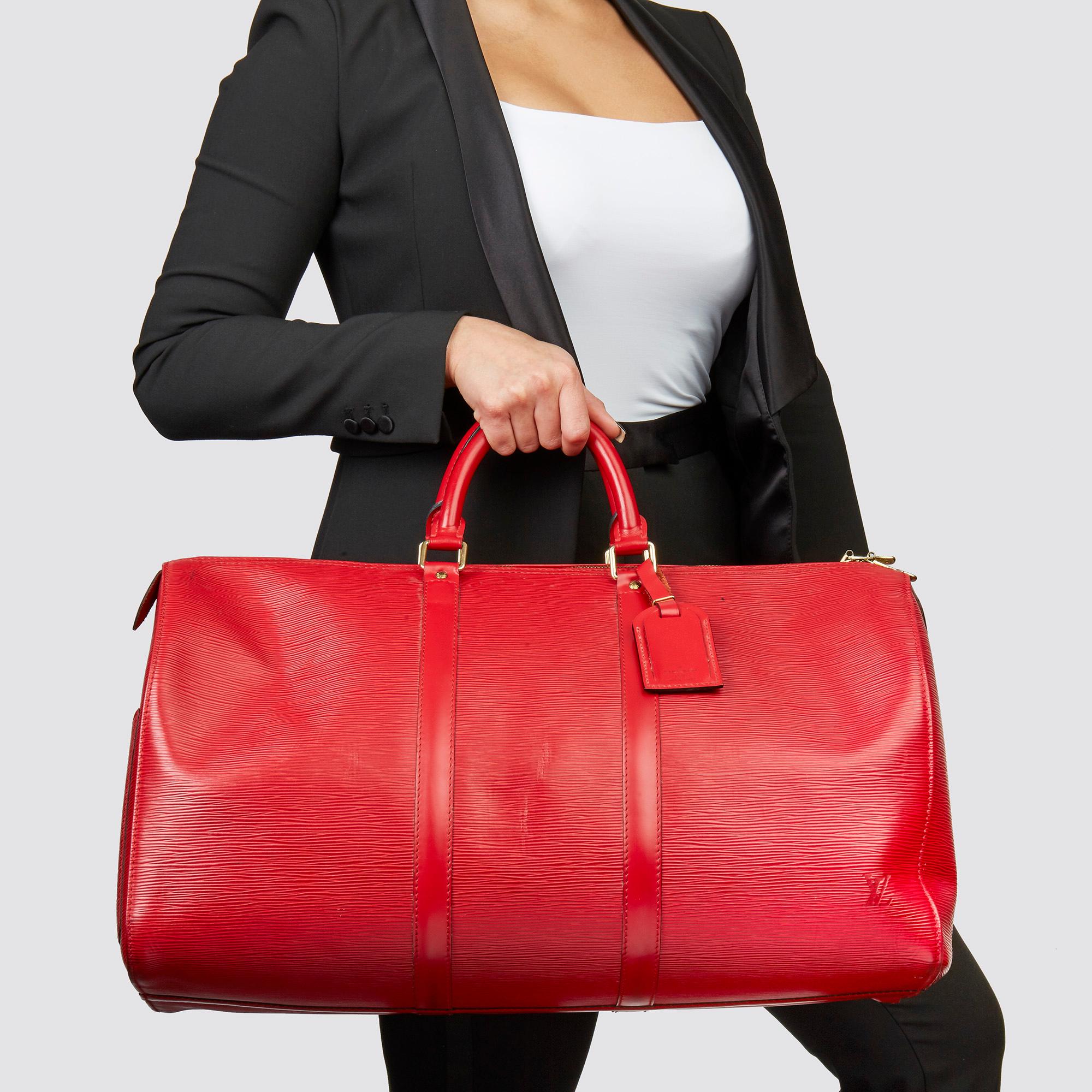 LOUIS VUITTON
Red Epi Leather Vintage Keepall 50 

Xupes Reference: HB3570
Serial Number: VI0935
Age (Circa): 1995
Accompanied By: Luggage Tag
Authenticity Details: Date Stamp (Made in France) 
Gender: Unisex
Type: Travel

Colour: Red
Hardware: