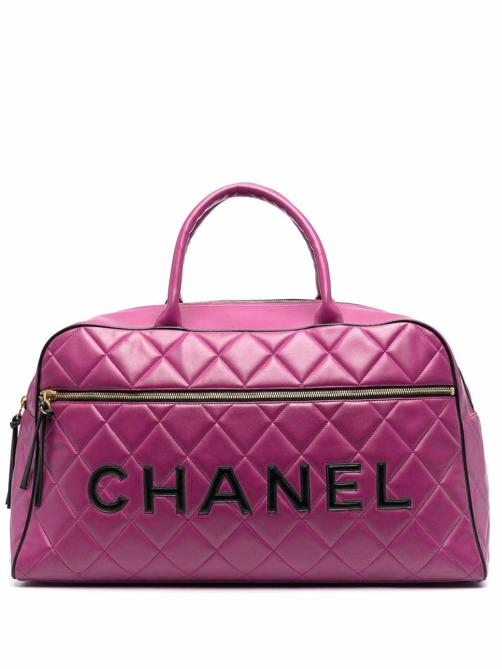 1995 Chanel pink quilted BOSTON bowling tote bag featuring a pink chevron quilted,  front black leather logo, top handles.
Circa 1995. 
Please note that vintage items are not new and therefore might have minor imperfections. 
Made in France
In good