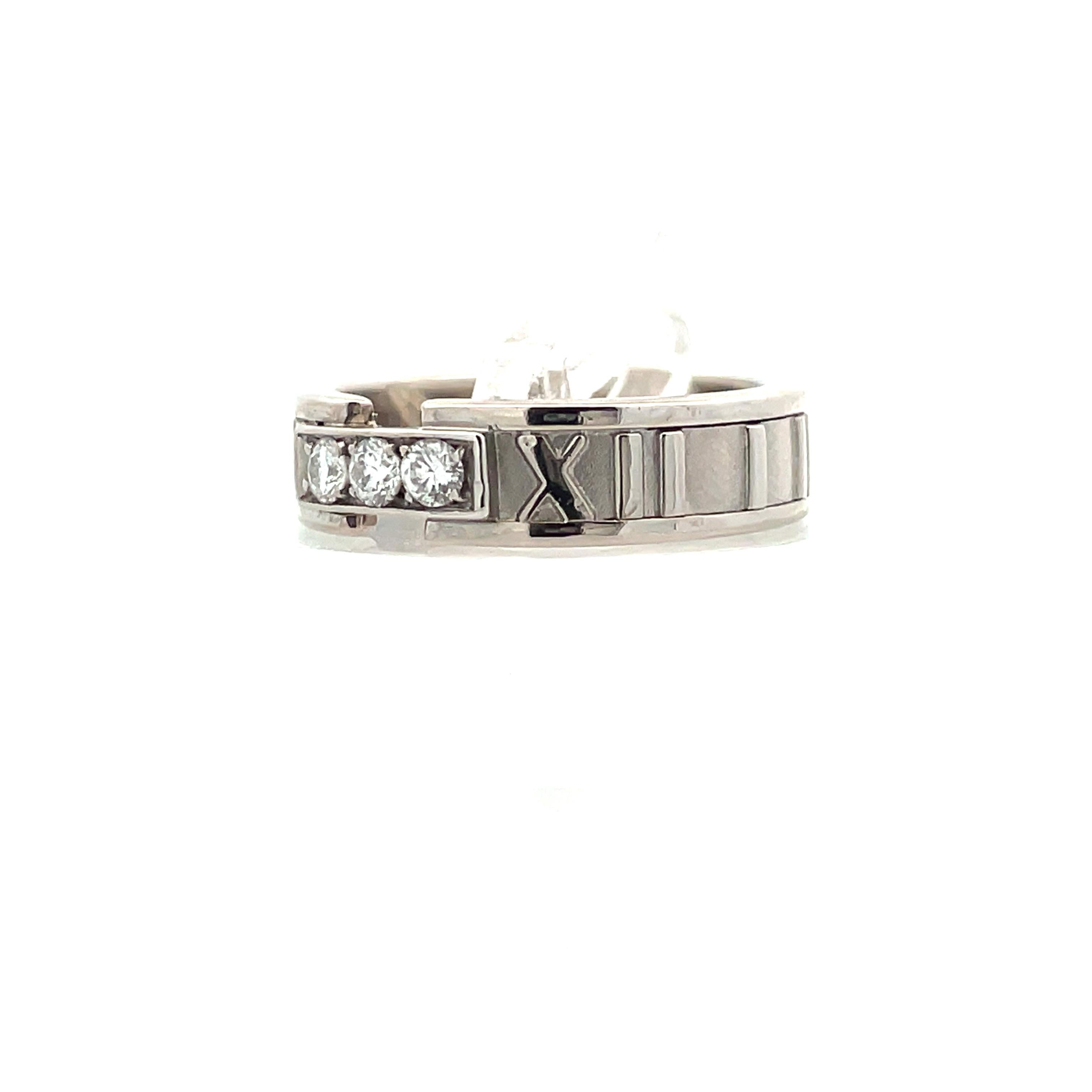 This white gold and diamond Tiffany & Co band with its Atlas design from 1995 is stunningly captivating. The Atlas collection features effortlessly confident pieces where sharply contemporary silhouettes meet timeless craftsmanship; an ode to