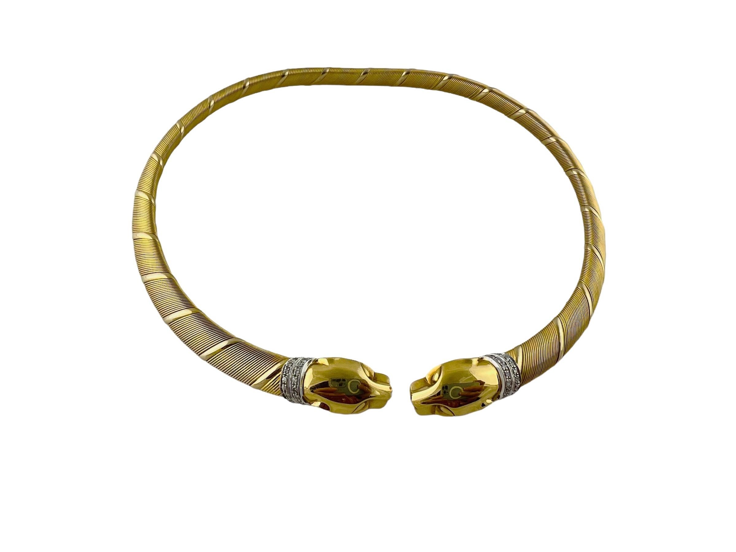1996 Cartier 18K Tri Color Gold Diamond Panther Choker

This vintage Cartier choker from the Panthere collection is set in 18K yellow, white and rose gold

Cable design with tri color ribbons decorate necklace. At the ends are two panthers, each