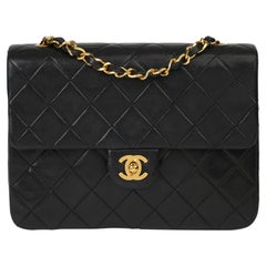 1996 Chanel Schwarze Mini-Klappentasche aus gestepptem Lammfell
