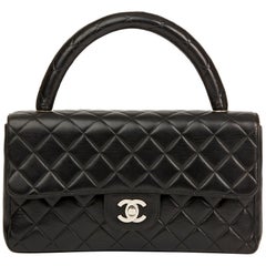 1996 Chanel Sac à rabat Classic Kelly Vintage en cuir d'agneau matelassé noir de taille moyenne