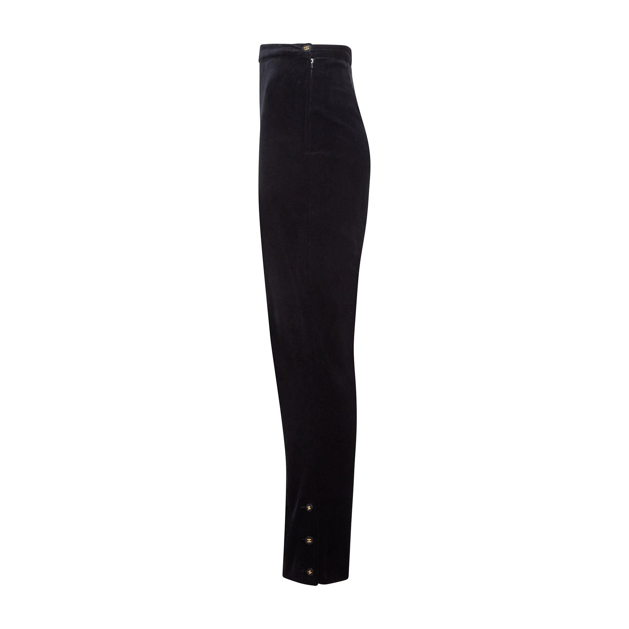 These elegant black velvet trousers were designed by Karl Lagerfeld for Chanel in 1996.  We're leaning more towards these being from spring 1996 on account of the button design for that entire collection matching this pair.  We have also included a
