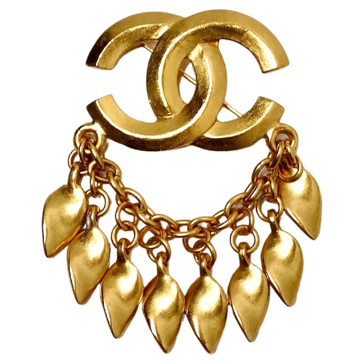 1996 Chanel Coco Mark Yellow Gold-Tone Brooch With Dangling Charms For Sale