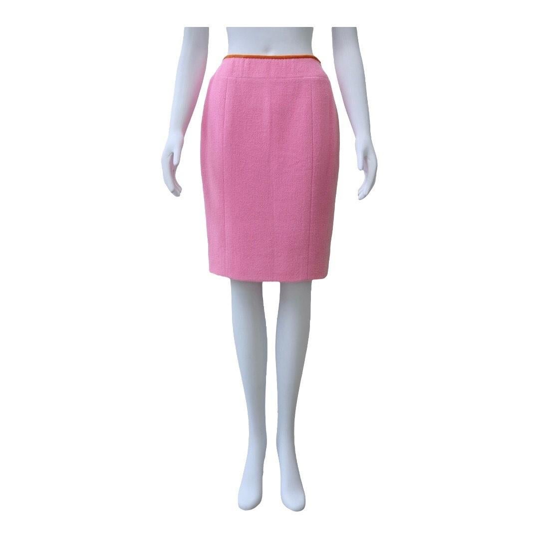 CHANEL Pink Wool Pencil Skirt with Orange Waistband Trim

Bright, playful, and perfectly tailored - this CHANEL pencil skirt features a bold pink wool body accented with a contrasting orange waistband for a modern pop of color. Cut in a classic