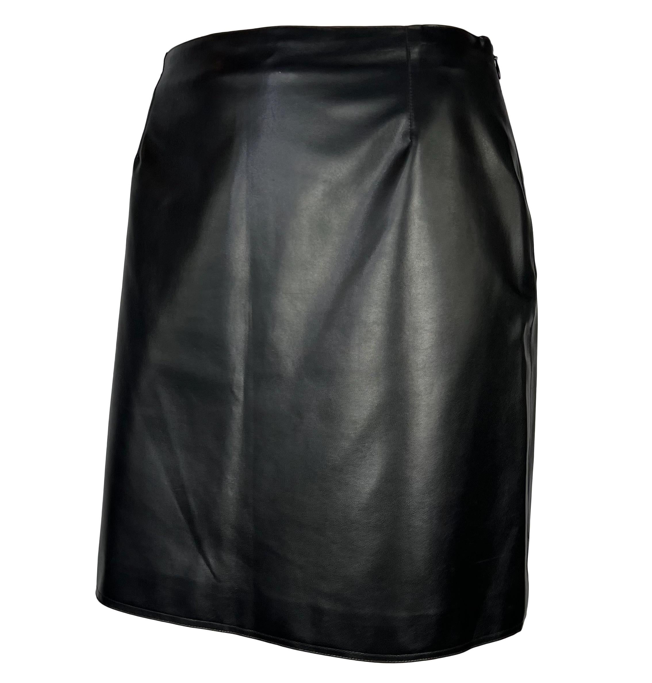 Presenting a fabulous black vegan leather Gianni Versace Couture mini skirt, designed by Gianni Versace. From 1996, this shiny faux leather skirt is a must-have essential for any wardrobe!

Approximate measurements:
Size - IT44 / US10
28.5