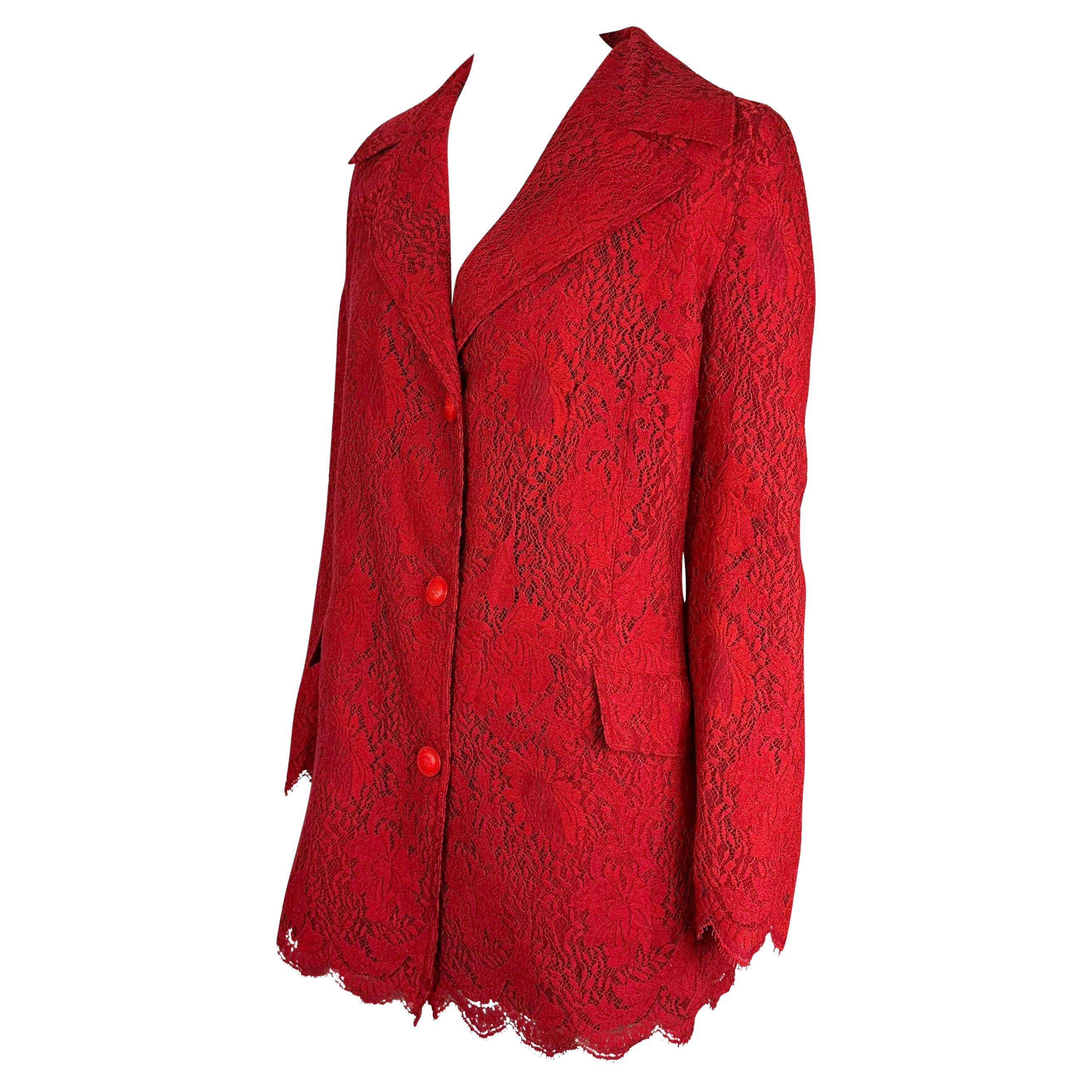 Presenting a fabulous red lace oversized Gianni Versace coat, designed by Gianni Versace. From 1996, this coat is constructed entirely of floral red lace and features a wide lapel, scalloped lace finishes at the hem, and is made complete with red