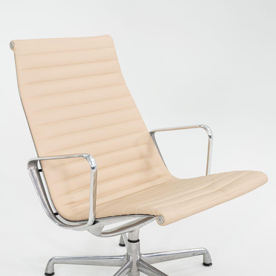 This is an Eames Aluminum Group lounge chair, model EA316, originally designed by Charles and Ray Eames for Herman Miller in 1958. This particular example dates to the year 1996. The design features a sling seat that affords a very comfortable