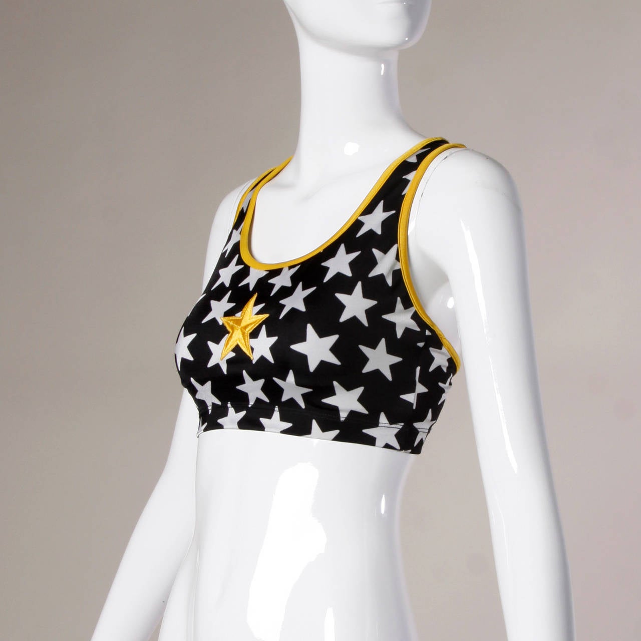 Iconic star print crop top with a sporty star applique by Norma Kamali. This crop top is from the Norma Kamali's OMO collection which was worn in the infamous gym scene of the 1996 cult classic movie Clueless starring Alicia