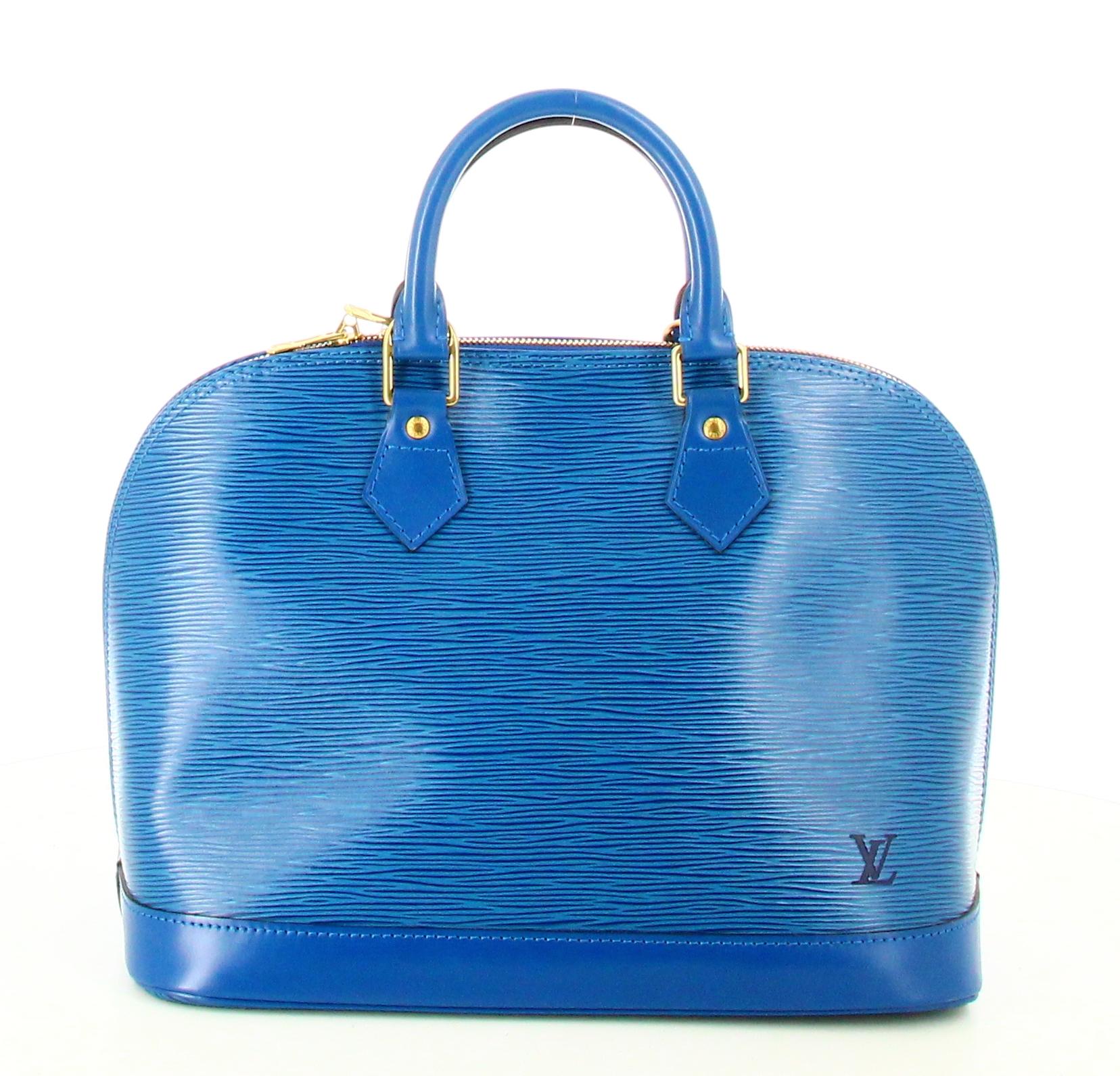 1996 Louis Vuitton Alma Bag Epi Blue Leather 

- Très bon état. Ne présente aucun signe d'usure dans le temps.
- Sac Louis Vuitton Alma 
- Cuir épi bleu
- Deux petites lanières de cuir bleu 
- Intérieur : daim bleu et petite poche intérieure