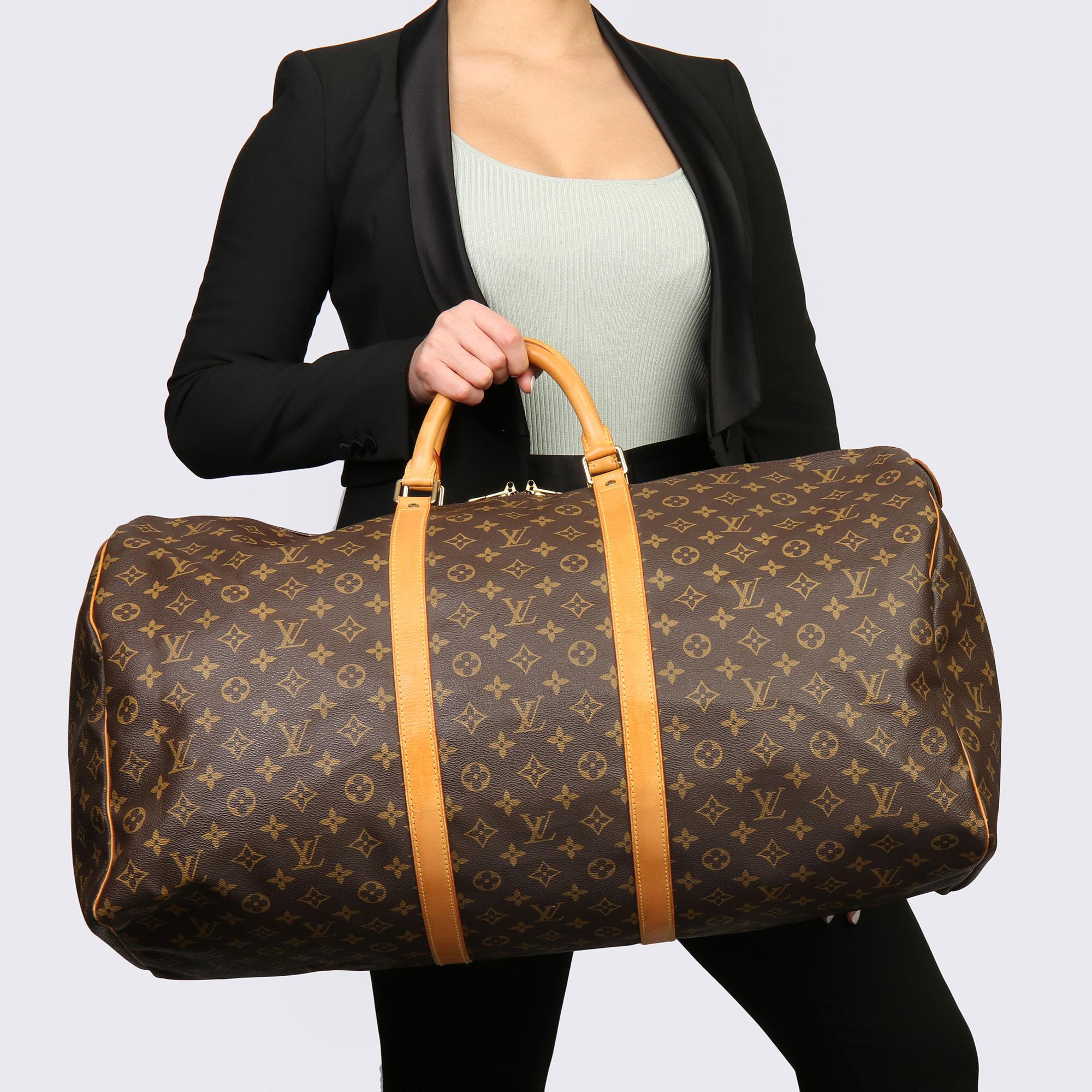 LOUIS VUITTON
Brown Monogram Coated Canvas & Vachetta Leather Vintage Keepall 55

Xupes Reference: HB3689
Serial Number: SP 1916
Age (Circa): 1996
Accompanied By: Luggage Tag, Handle Keeper
Authenticity Details: Date Stamp (Made in France) 
Gender: