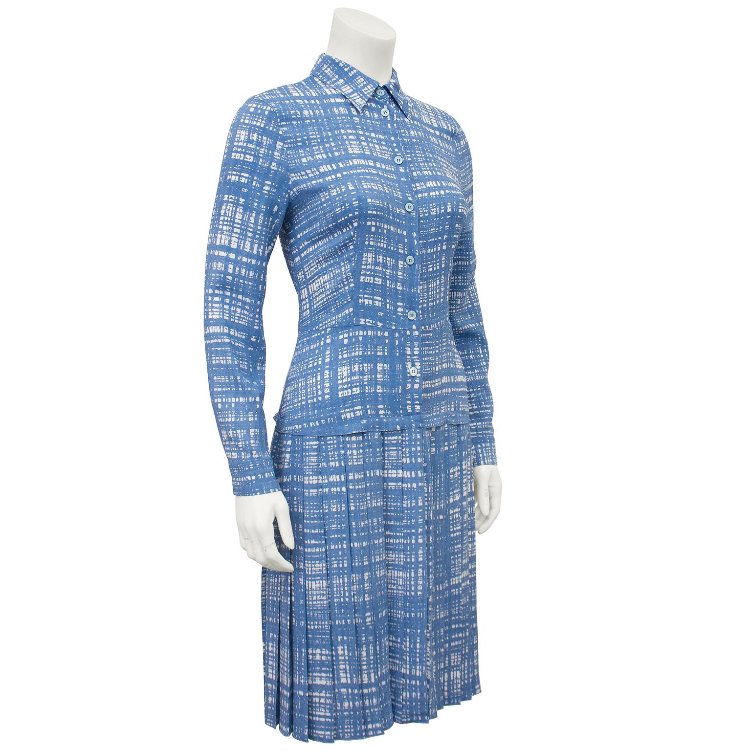 Prada blue checked shirtwaist dress from the 1996 Spring Ready to wear collection. The Graffiti checked print was featured on many pieces on the runway in navy, green and brown. This version is in a lighter blue shade on a nylon silk blend. The