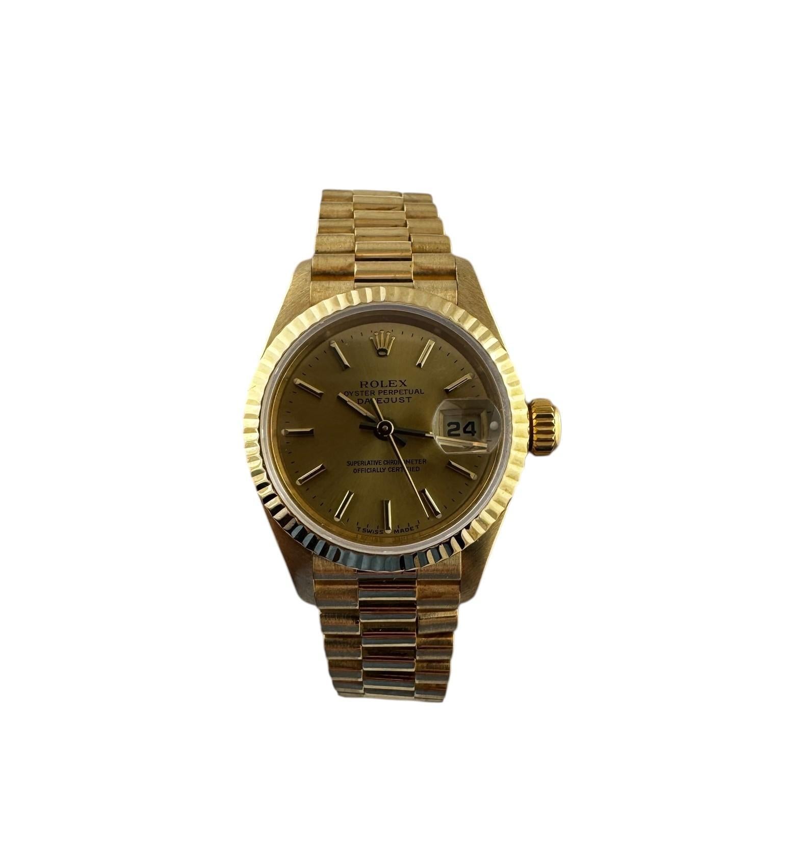 1996 Rolex Ladies 18K Yellow Gold Presidential Watch

Model: 69178
Serial: T302928

This classic Rolex ladies watch is set in 18K yellow gold.

Case is 26mm in diameter

Champagne dial with gold stick markers and date

Automatic movement

Fits up to