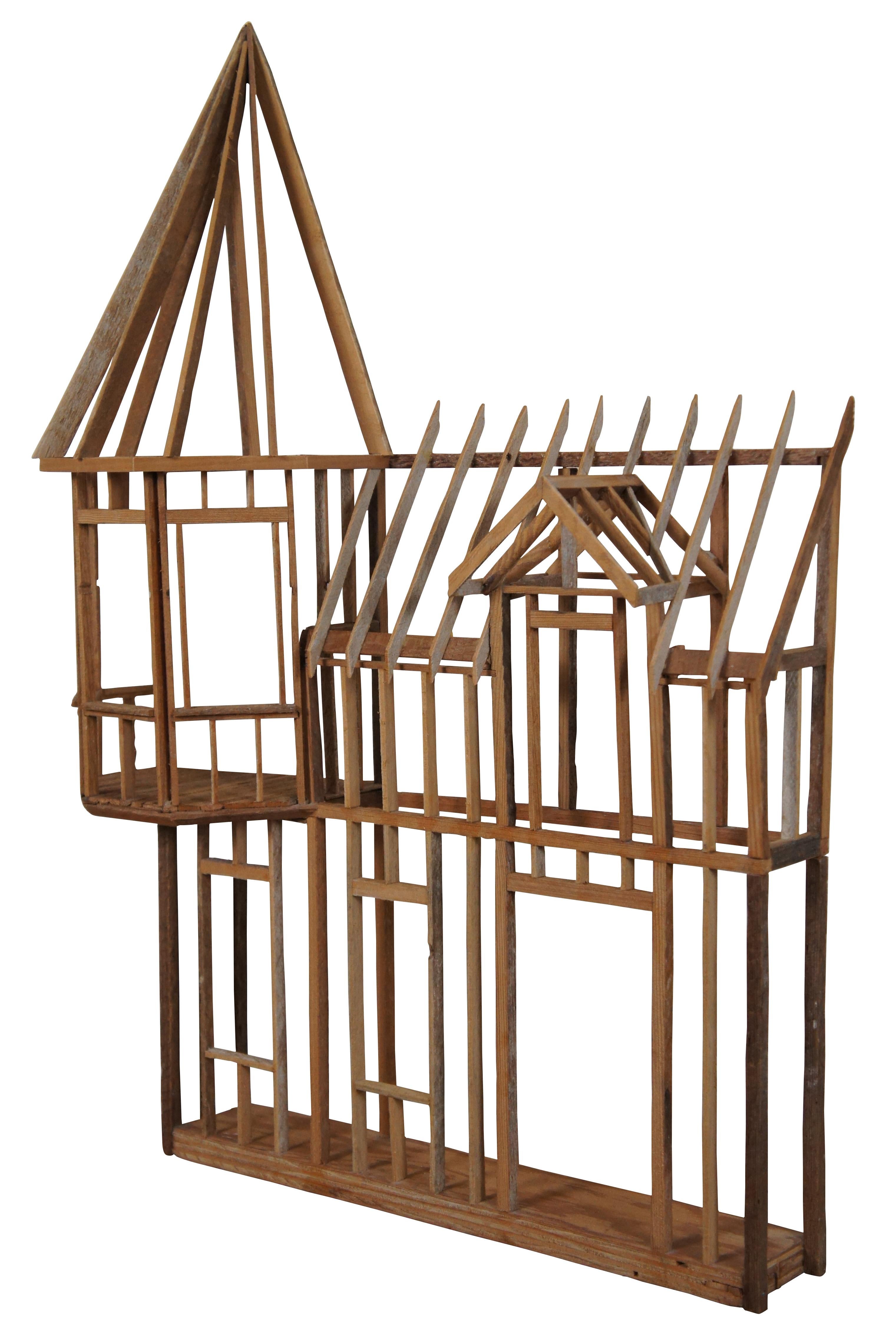 Unique piece of hand crafted wooden wall art trinket display, representing the front facade of a doll house or house shaped bird cage. Marked “Handcrafted by Ron Hundt – Completed Aug. 1996”.
Measures: 30