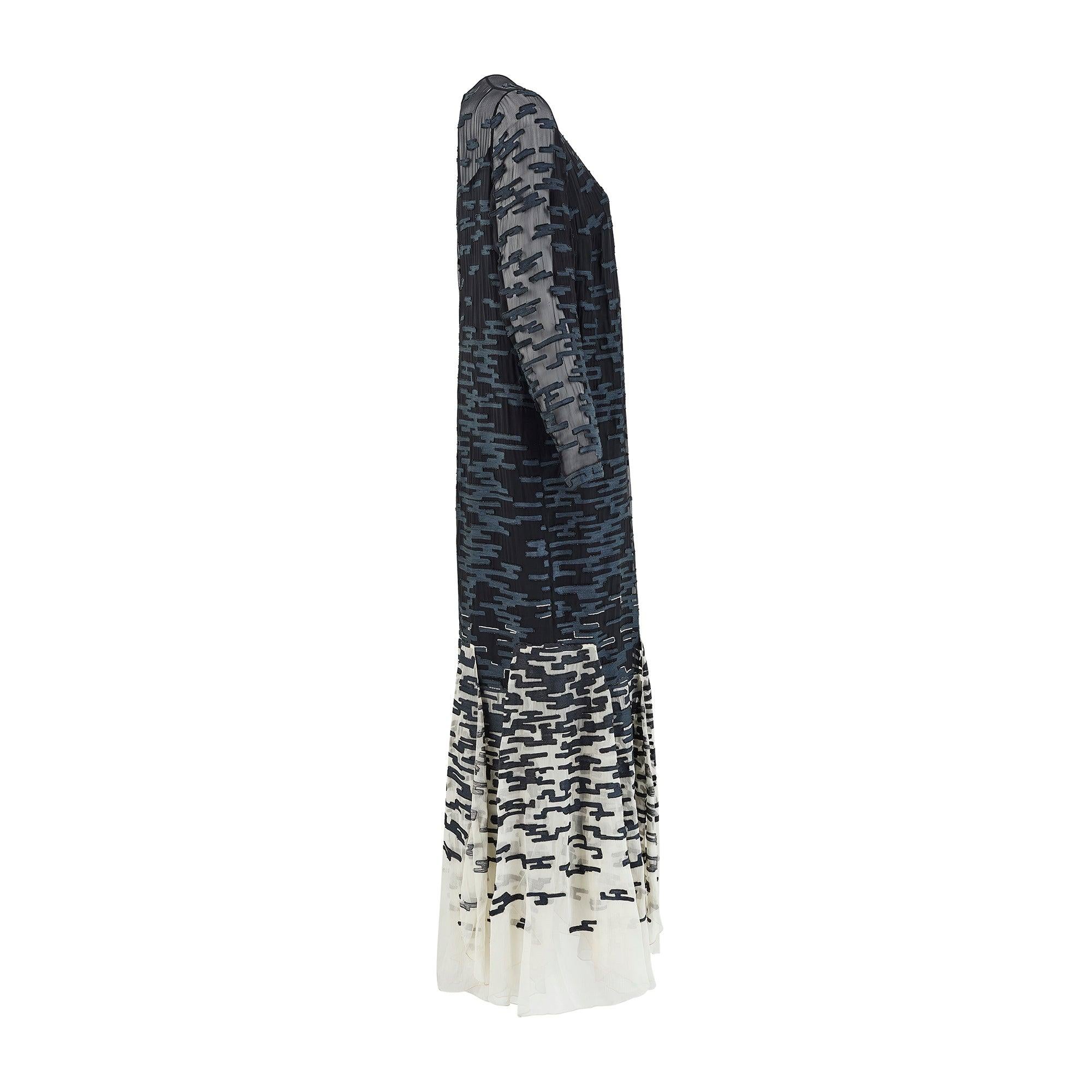 This elegant Chanel monochrome evening dress was ordered directly from the spectacular Fall 1996 Haute Couture show, held at the Ritz, Paris, in January of that year.  It is a long sleeve version of Look 52 and in all other respects is the same as