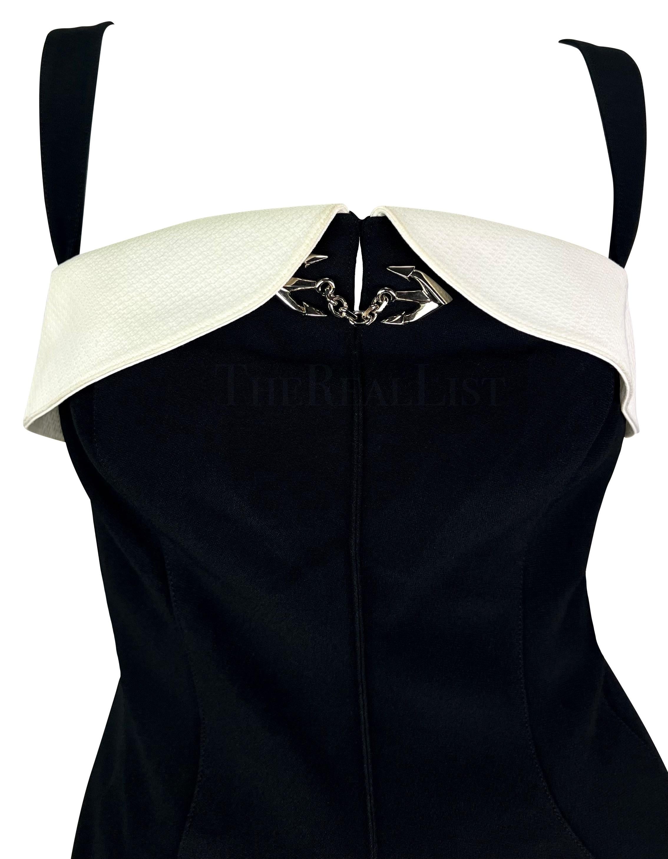 Presenting a black and white nautical Thierry Mugler mini dress, designed by Manfred Mugler. From 1996, this dress features a black body and straps and a white fold-over accent above the bust. The sleeveless dress features an angular neckline and is