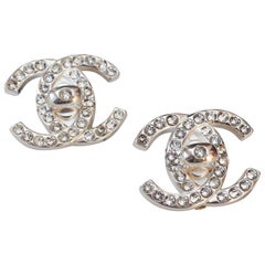 1996A CHANEL Pair of silver plated clip on earrings with the CC logo