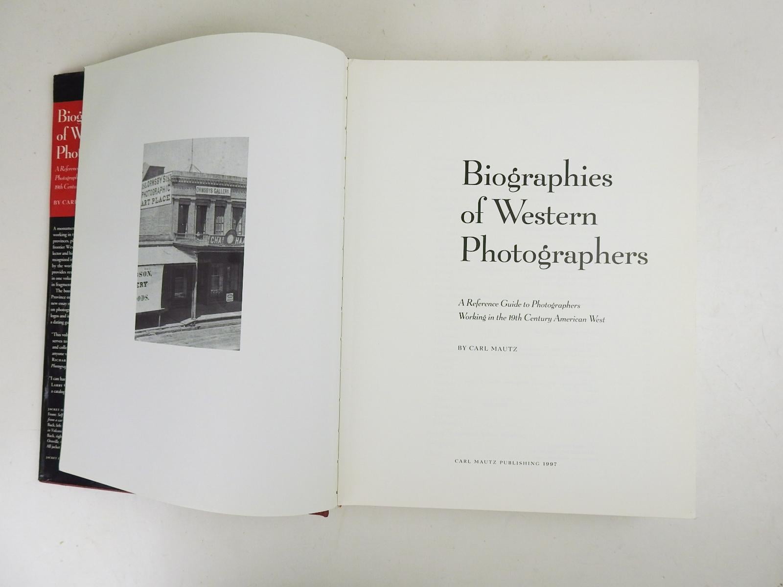 Biographies of Western Photographers 1840-1900 by Carl Mautz.  Published by Carl Mautz Nevada City California, 1997.  Red cloth hardcover binding, illustrated dust jacket, edge wear to dust jacket.